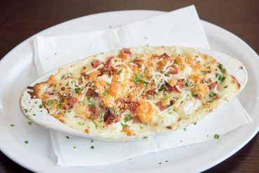 Baked Gnocchi Gorgonzola Italian potato dumplings, prosciutto, fresh basil, and creamy Gorgonzola sauce.