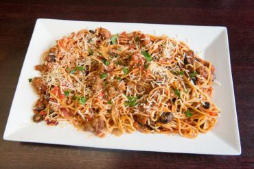 Spaghetti Pavia Pasta Olive oil, Italian sausage, garlic, tomatoes, mushrooms, onions, olives, and marinara sauce.