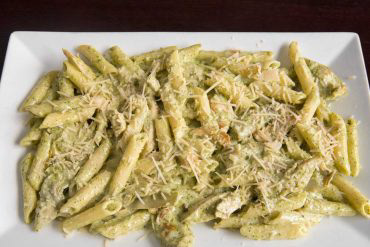 Pelle Pollo & Broccoli Pasta Penne pasta with chicken, broccoli, roasted red pepper, and mushrooms in a creamy pesto sauce.