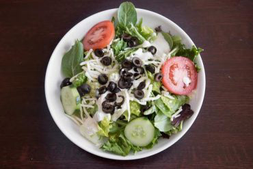 Dinner Salad Crispy lettuce, tomatoes, cucumber, black olives, and mozzarella cheese with your choice of dressing.