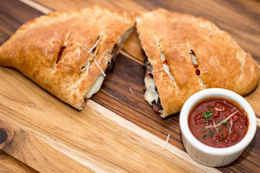 Create Your Own Calzone By adding your favorite pizza toppings to our mozzarella, and ricotta base.