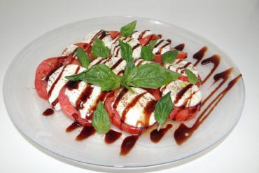 Caprese Salad A true Italian salad made with fresh mozzarella, fresh basil, tomatoes, and extra virgin olive oil.