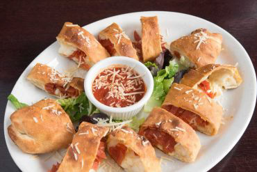 Pepperoni Rolls Pepperoni, mozzarella, and parmesan cheese. Rolled up in strips of our famous pizza dough and baked to perfection. Served with marinara sauce.