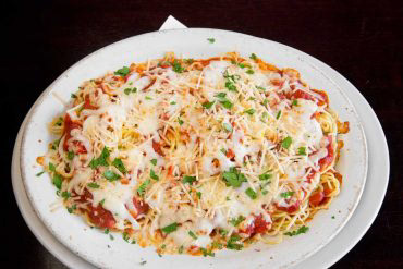 Baked Spaghetti Spaghetti, mozzarella, parmigiana, and your choice of marinara or meat sauce.