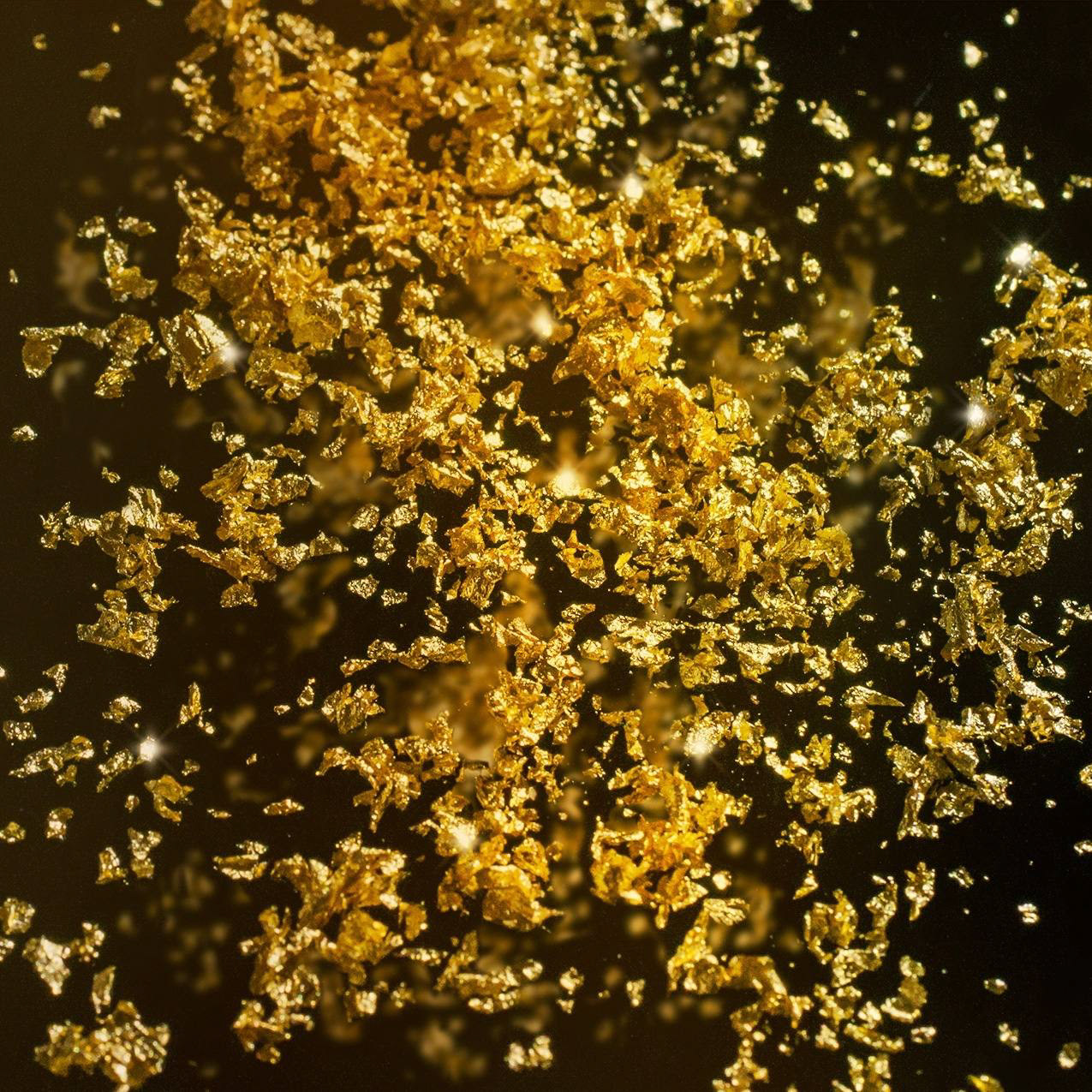 Macro de oro comestible 24K suspendido en AOVE premium.