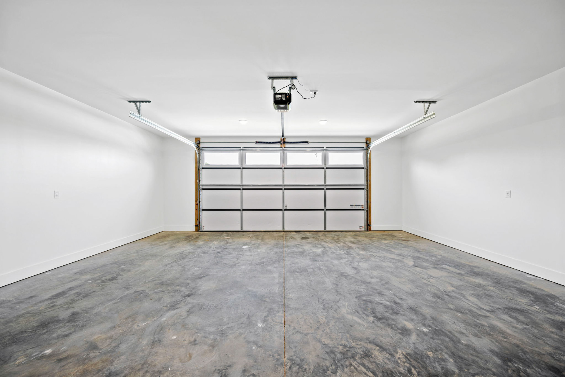 Attached 2 car Garage Featuring Insulated Door