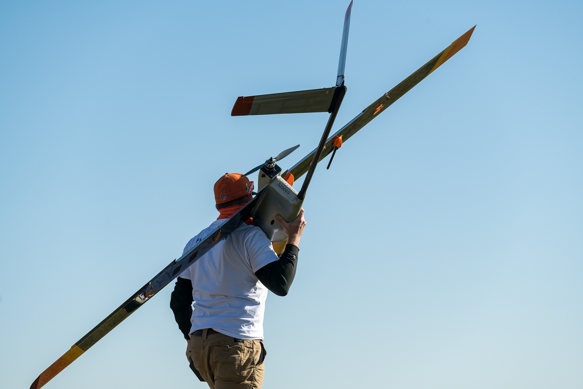 Jack Elston, Ph.D bring a drone home after a flight.