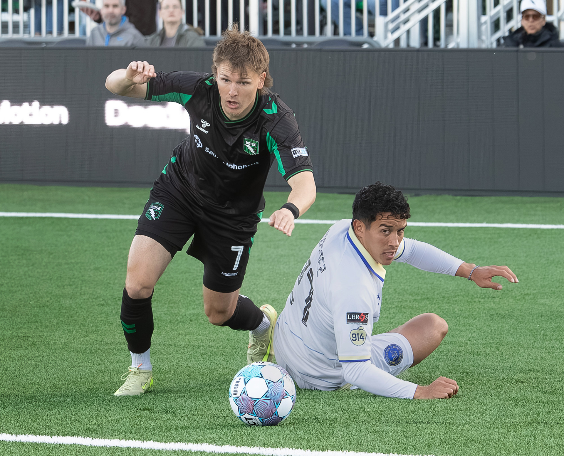 Blake Bodily (7) for Athletic Club Boise gets the ball past Jonathan Jimenez (27) for Westchester Soccer Club during soccer match at Les Bois Park on Saturday.
