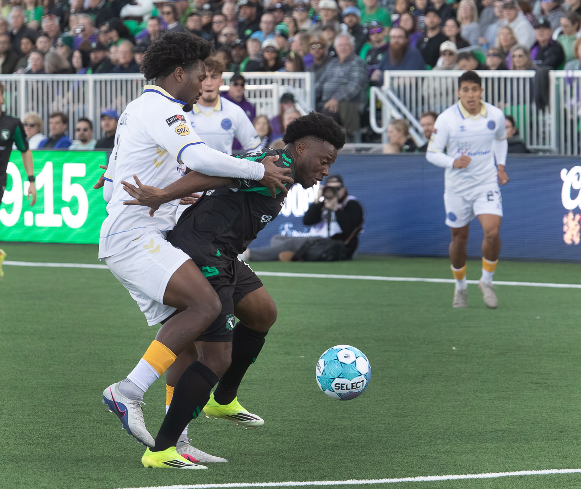Athletic Club Boise's Thomas Amang (22) tries to maneuver the ball away from Bobby Pierre (4) of  Westchester Soccer Club during soccer match at Les Bois Park on Saturday, April 18, 2026.
