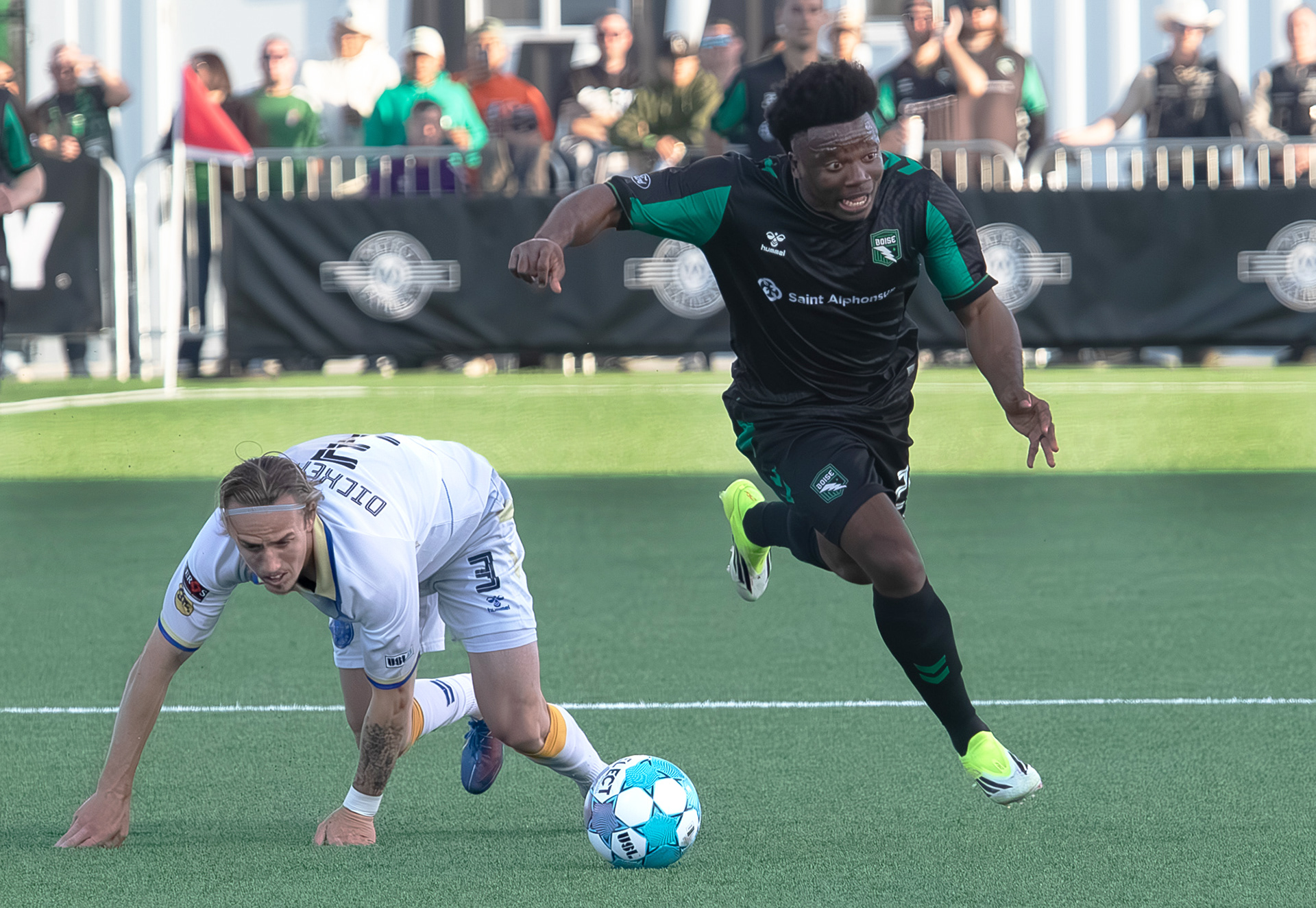 Athletic Club Boise's Thomas Amang (22) keeps the ball against  Westchester Soccer Club's Charlie Dickerson during soccer match at Les Bois Park on April 18, 2026.