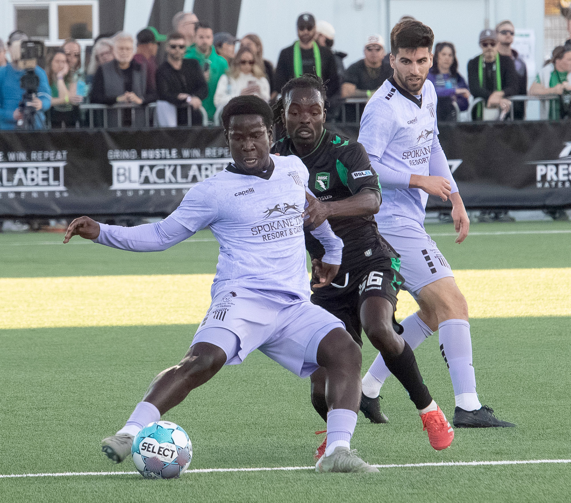Philip Mayaka #66 for AC Boise tries to get the ball from Medgy Alexandre #17 for Spokane Velocity during first home game for AC Boise at Les Bois Park on Saturday 4.4.26
