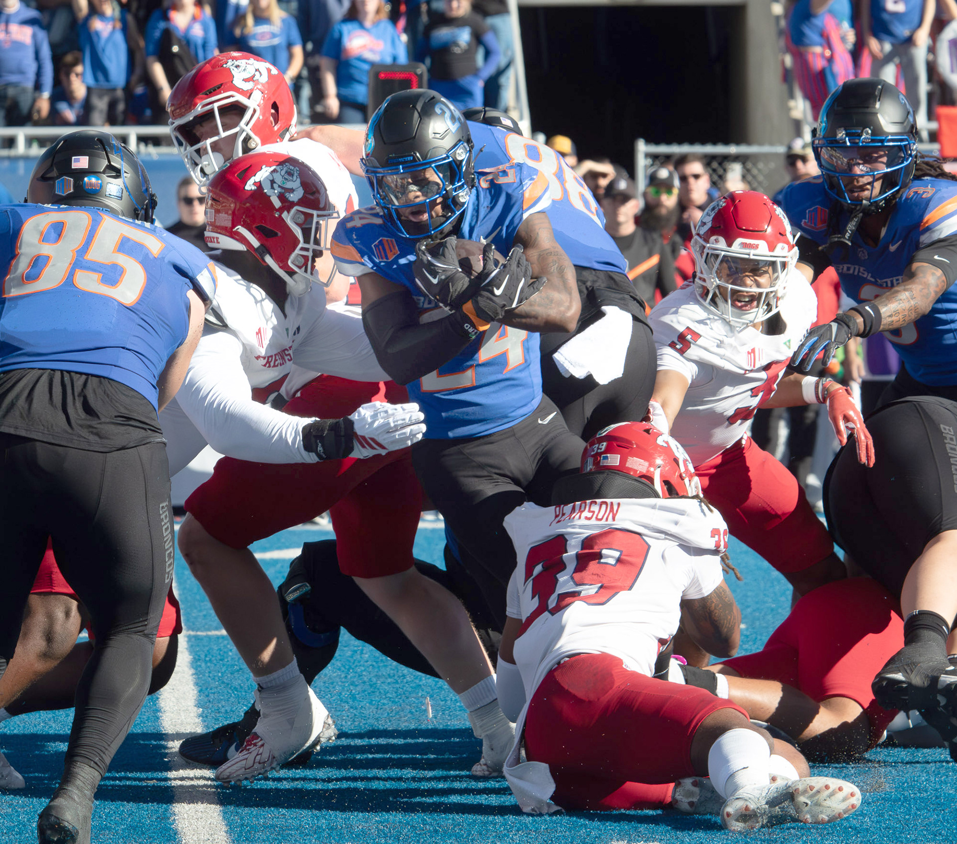 Dylan Riley, running back for Boise State University, hits the defensive Fresno State wall during football game at Albertsons Stadium Saturday, November 1, 2025