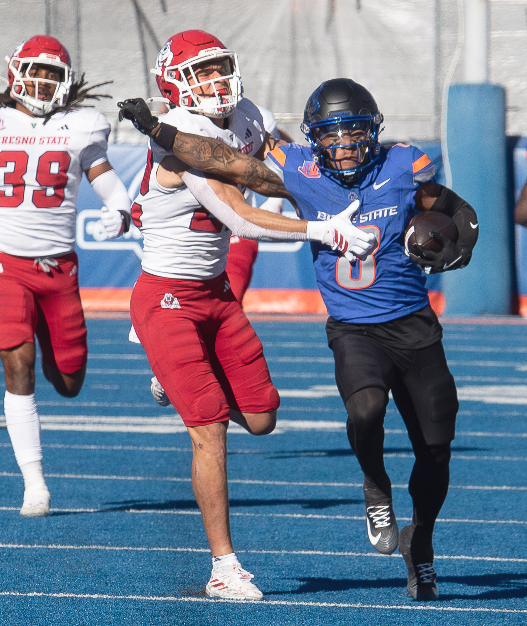 Boise State University's Malik Sherrod is tackled by Fresno State's Andre Cobb at Albertsons Stadium  Saturday, November 1, 2025
