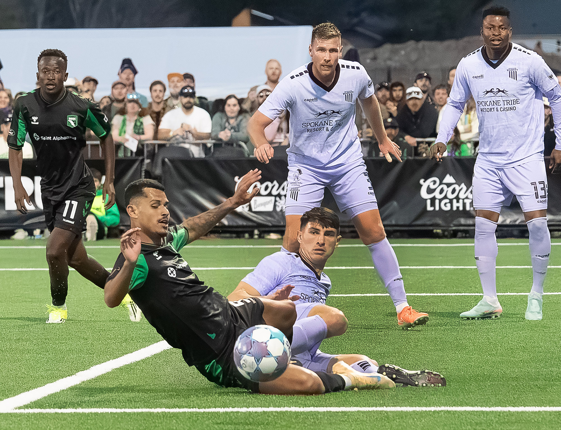 Luan Figueiroa Brito #9 for AC Boise and Camron Miller #12 Camron Miller #12 for Spokane Velocity both go for the ball during first home field soccer matdh at Les Bois Park on Satuday 4.4.26