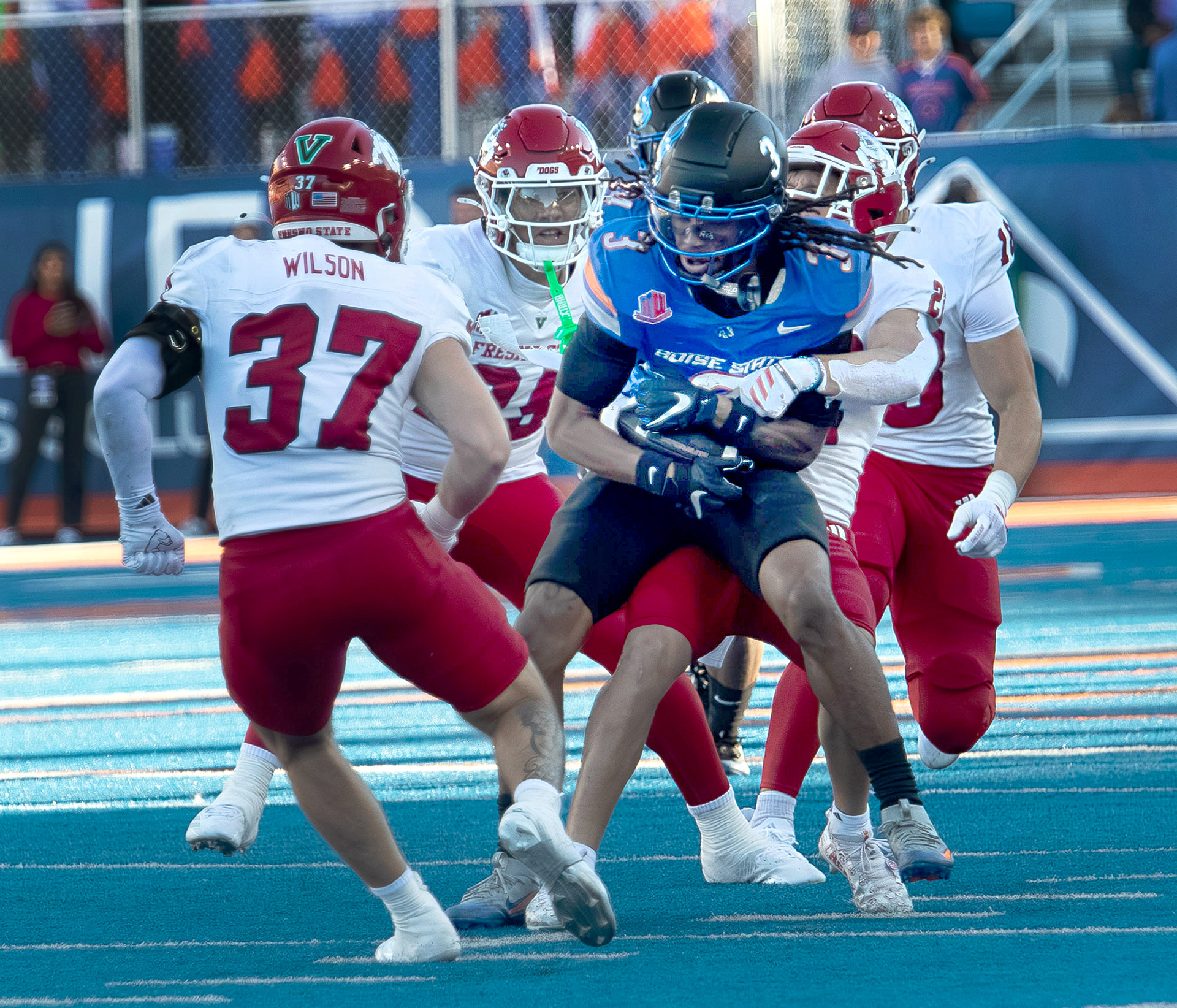 Boise State University's Latrell Caples gets tackled after making a catch during football game against Fresno State at Albertsons Stadium Saturday, November 1, 2025