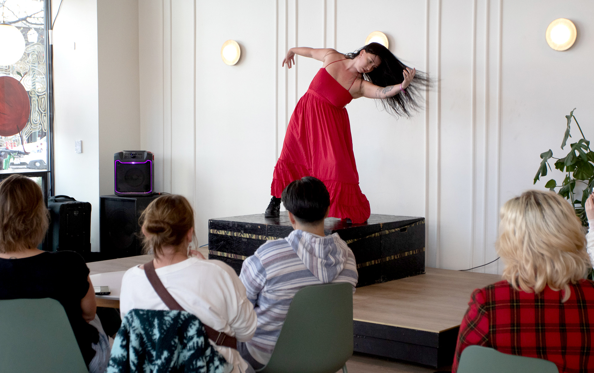 A member of Off Center Dance performs her dance at The District Coffee HouseA member of Off Center Dance performs her dance at The District Coffee House