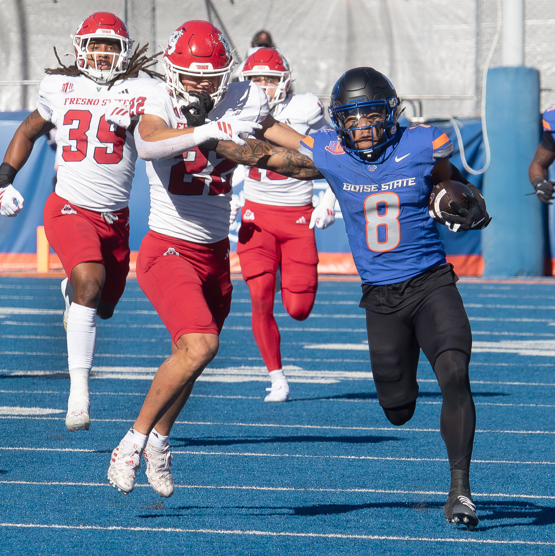 Boise State University's Malik Sherrod is tackled by Fresno State's Andre Cobb at Albertsons Stadium  Saturday, November 1, 2025