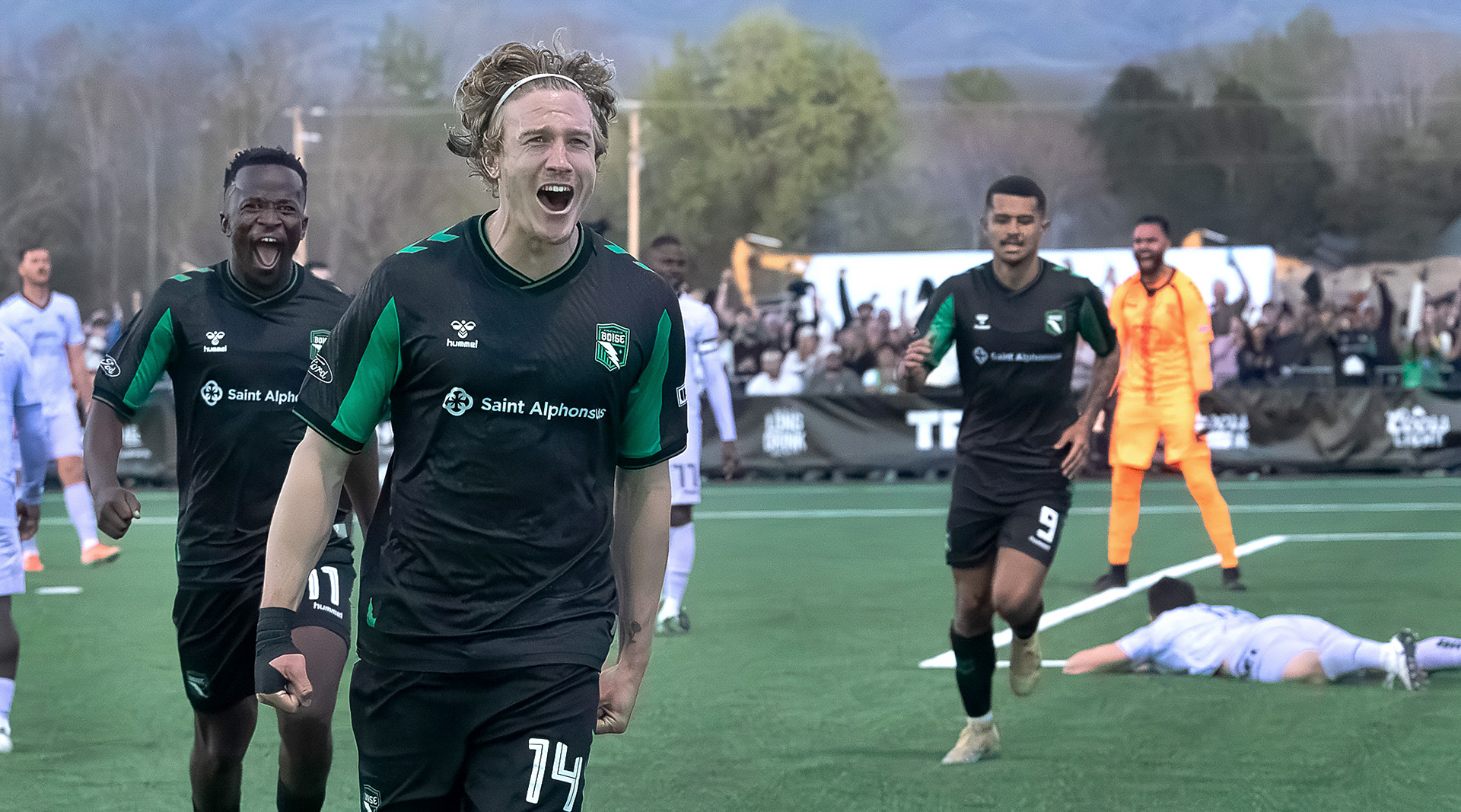Nick Moon (14) celebrates a goal with Tumi Moshobane #11 during AC Boise's first home game played against Spokane Velocity on Saturday 4.4.26