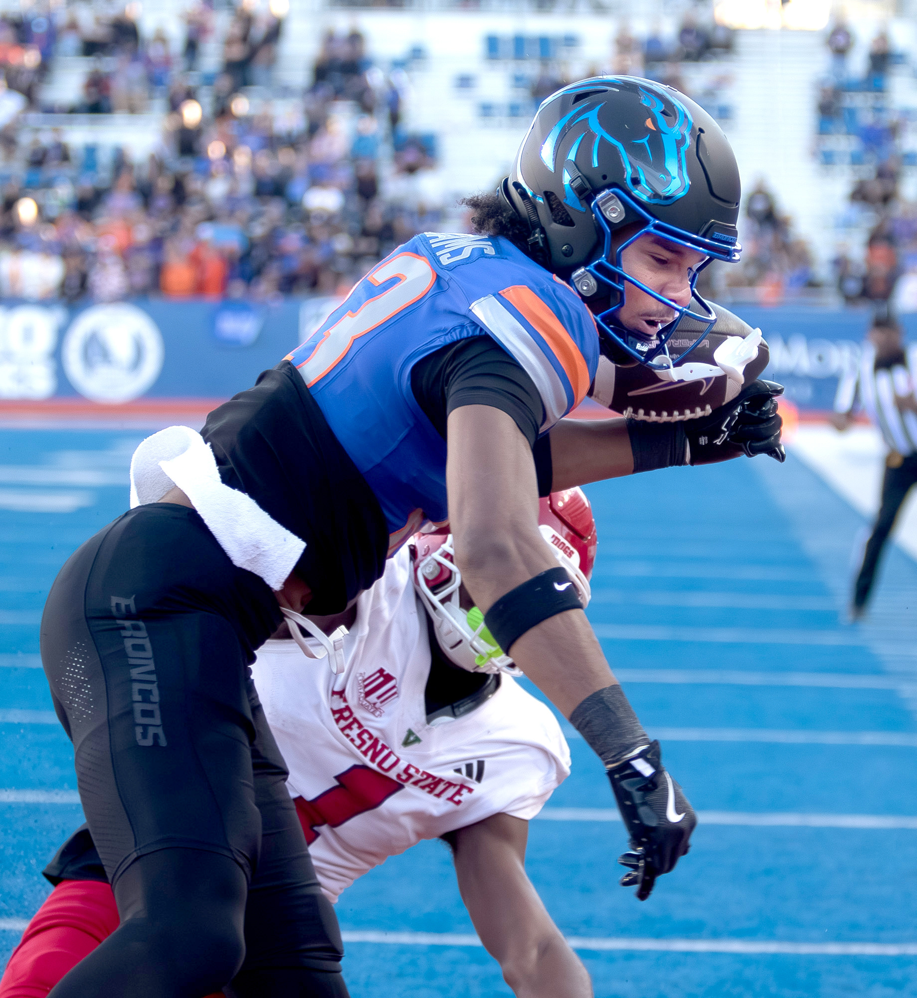 Boise State University's Qumonte Williams Jr. is kept from catching a pass during football game against Fresno State at Albertsons Stadium Saturday, November 1, 2025