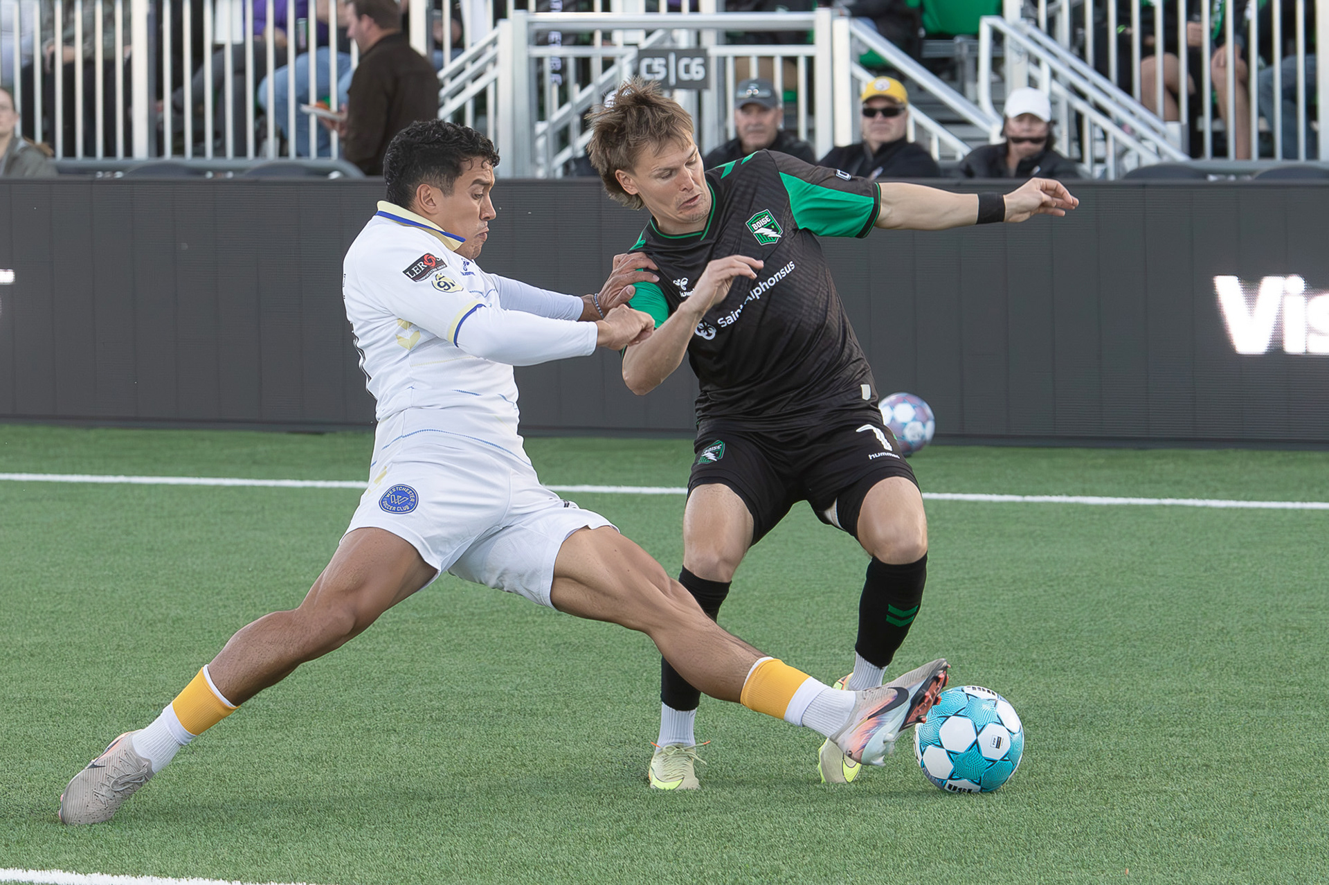 Blake Bodily (7) for Athletic Club Boise gets the ball past Jonathan Jimenez (27) for Westchester Soccer Club during soccer match at Les Bois Park on Saturday.