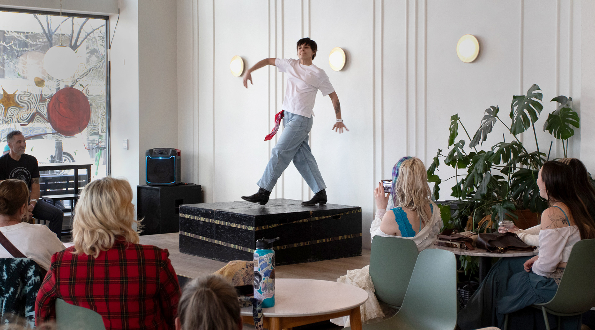 A member of Off Center Dance performs her dance at The District Coffee House