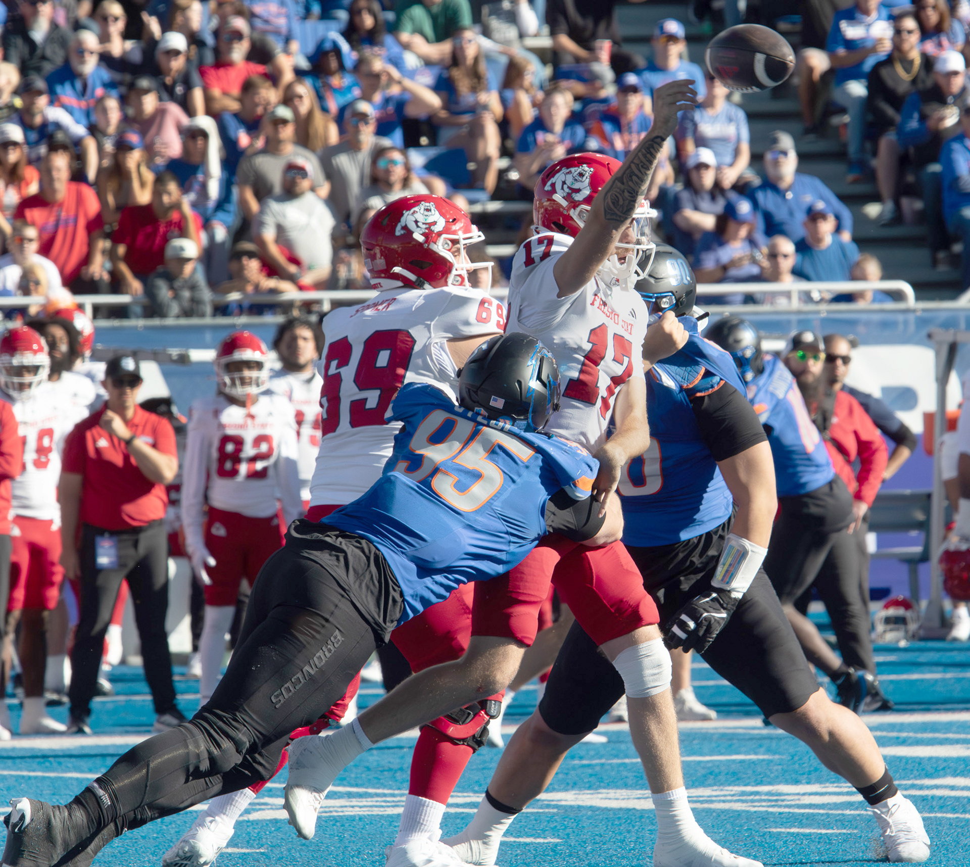 Boise State University's defense tackling Fresno State quarter back during football game Albertsons Stadium Saturday, November 1, 2025