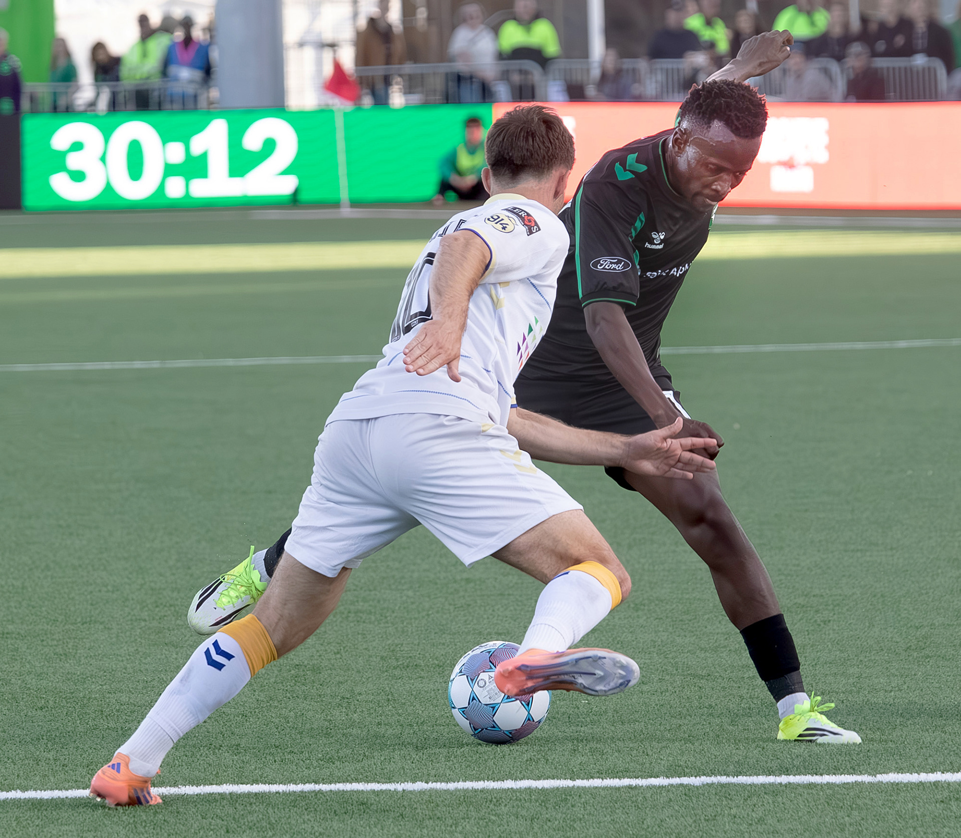 Athletic Club Boise's Tumi Moshobane (11) dribbles the ball around Dean Guezen (10) of Westchester Soccer Club during soccer match at Les Bois Park on Saturday, April 18, 2026.