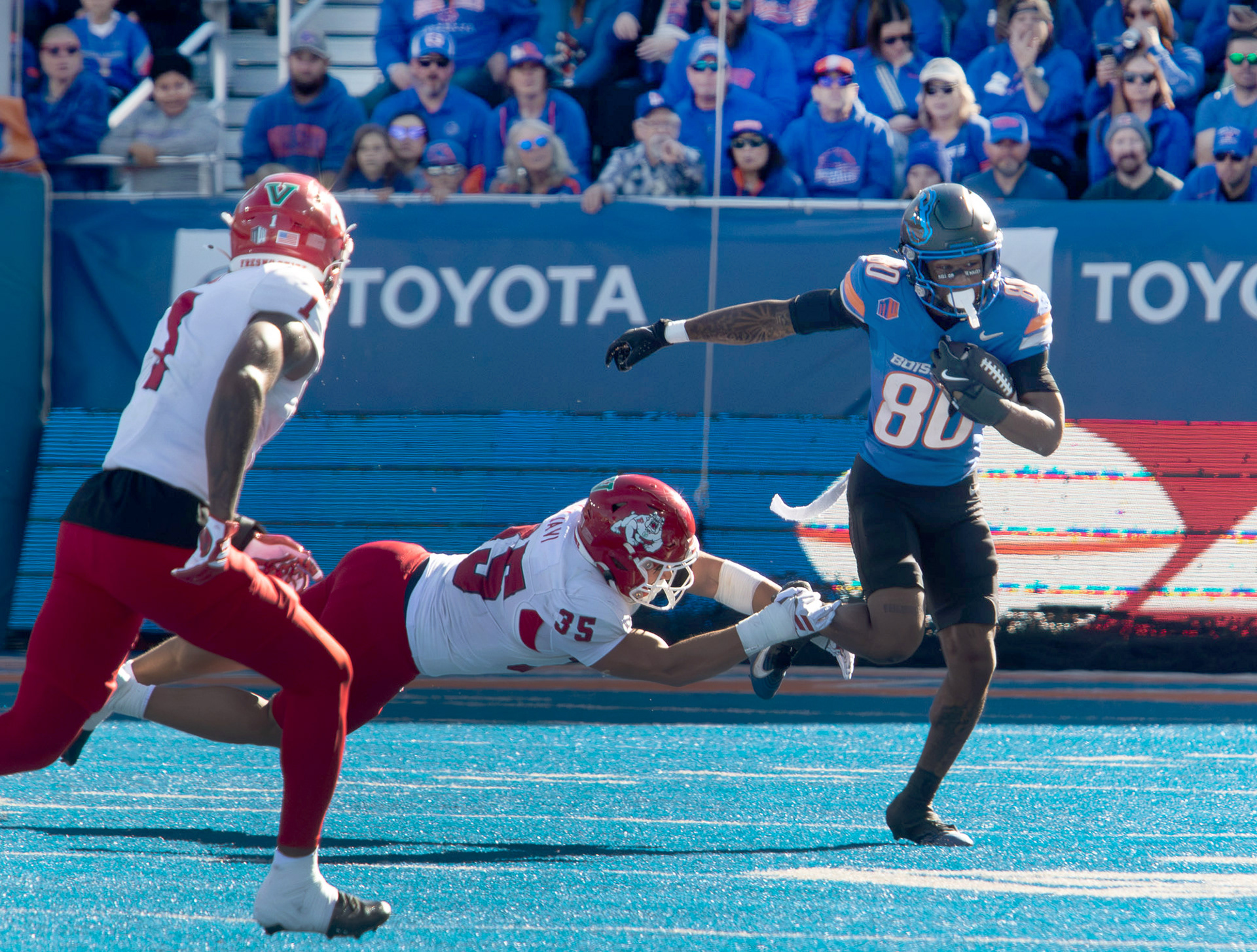 Cameron Bates, wide receiver for Boise State University escapes a tackle during football game against Fresno State  at Albertsons Stadium Saturday, November 1, 2025