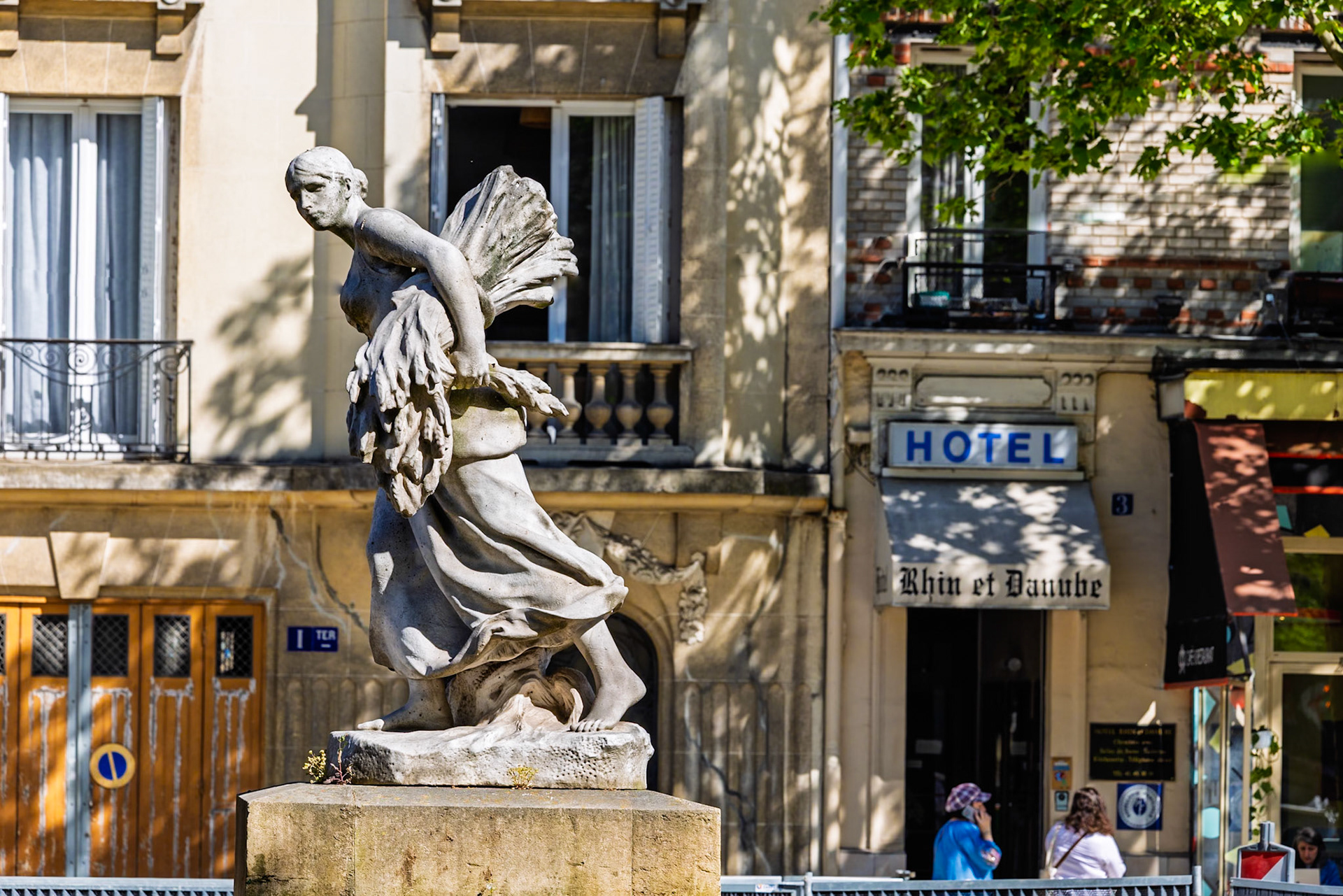 This elegant marble statue by Jules Roulleau depicts a young woman in motion, gathering a heavy sheaf of wheat to her hip. Her drapery flows dynamically around her legs, emphasizing both grace and labor. Created in the spirit of French academic realism, La Moisson celebrates the agricultural rhythms that shaped French rural identity.