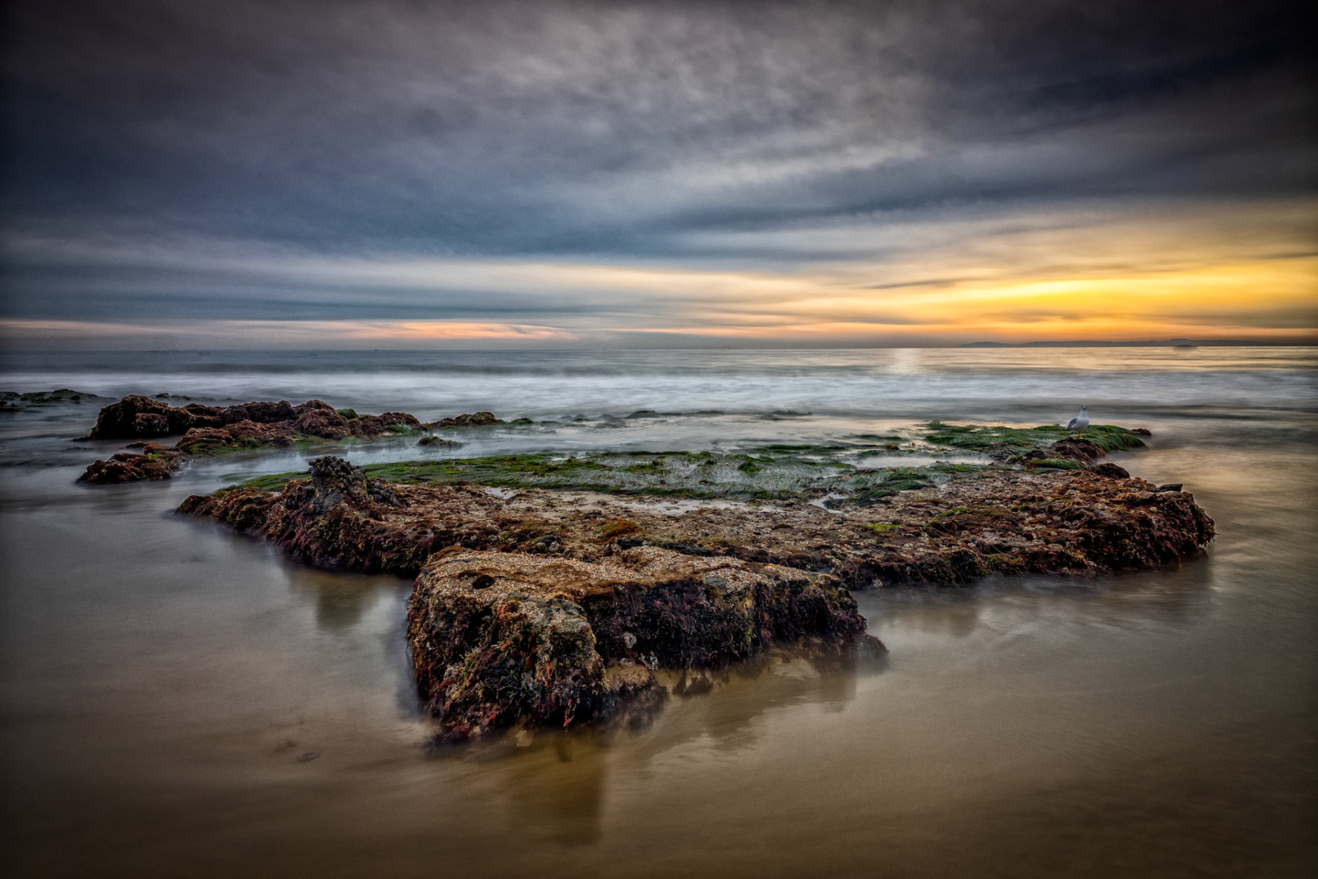 This long-exposure along Newport Coast exposes the life filled rock formations that are homes to various types of sea life.