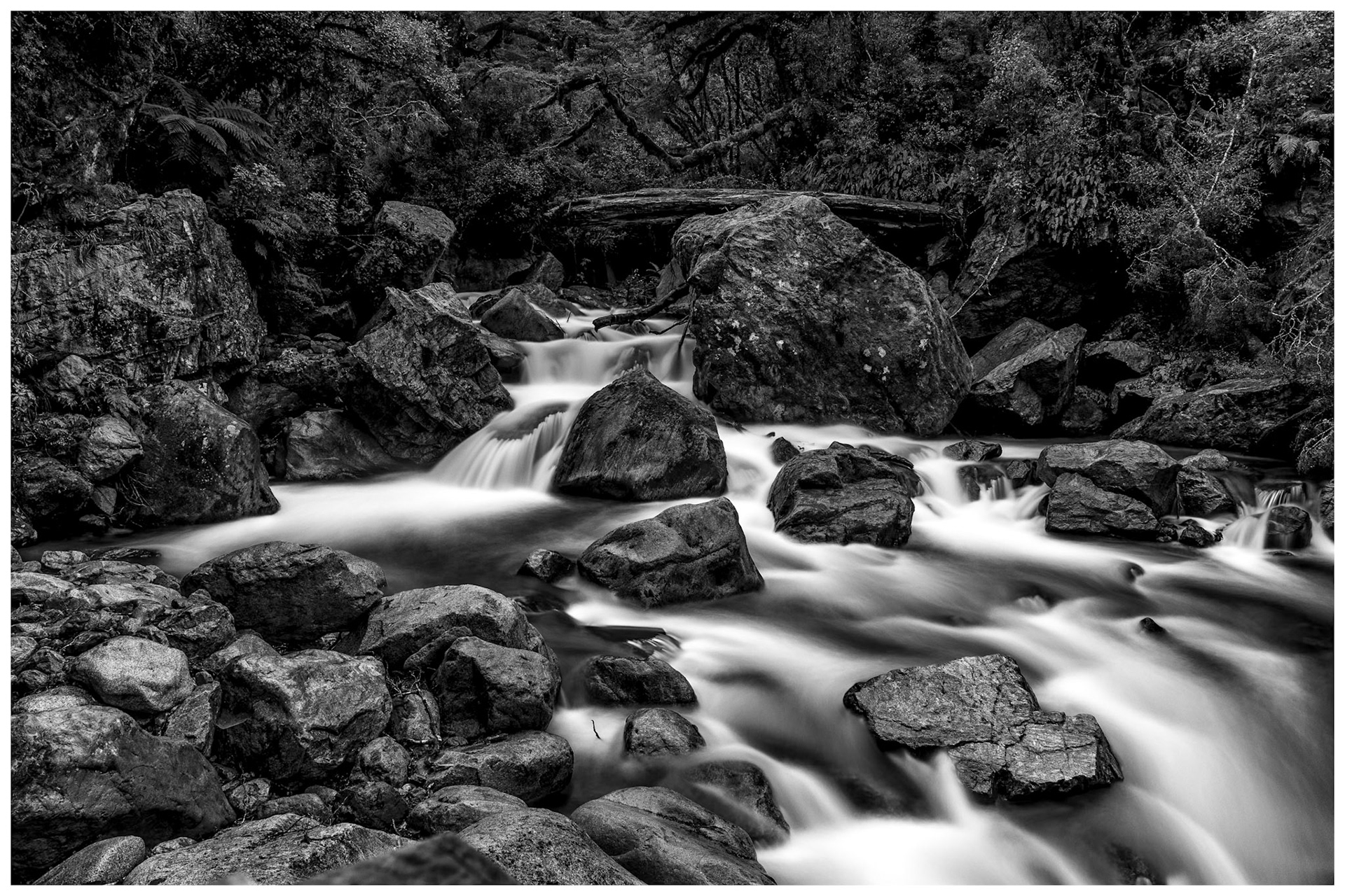 I love finding less known locations and capturing them for enternity and sharing them with others.  This 15 second time lapse near Milford Sound, New Zealand helps creates the milky flow of the river set against the motionless natural river rocks.  Looks great in color as well.