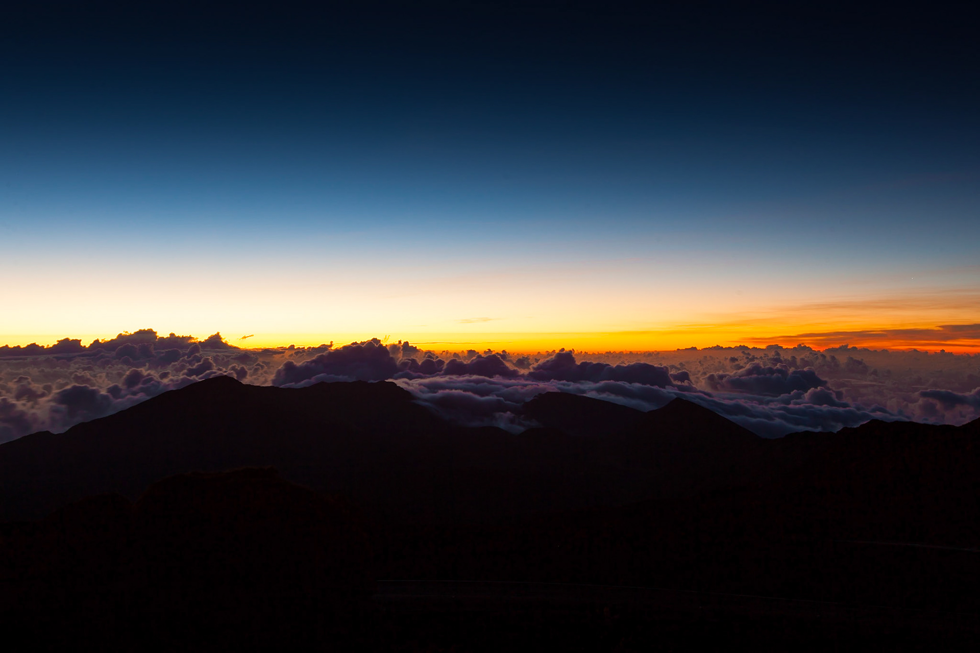 Waking up at 3am to journey to the top of Haleakalā National Park Maui, Hawaii to watch sunrise did not disappoint.  Unique perspective above the Clouds where you almost feel like can see the curve of the earth.