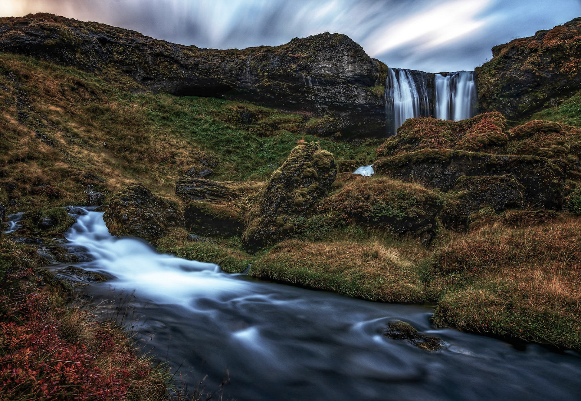 Driving the roads of Iceland we pulled over for a small break.  Upon getting out of the car I heard the faint sound of a waterfall and after a 8 minute stroll found this lonely waterfall just flowing away for no one to see.