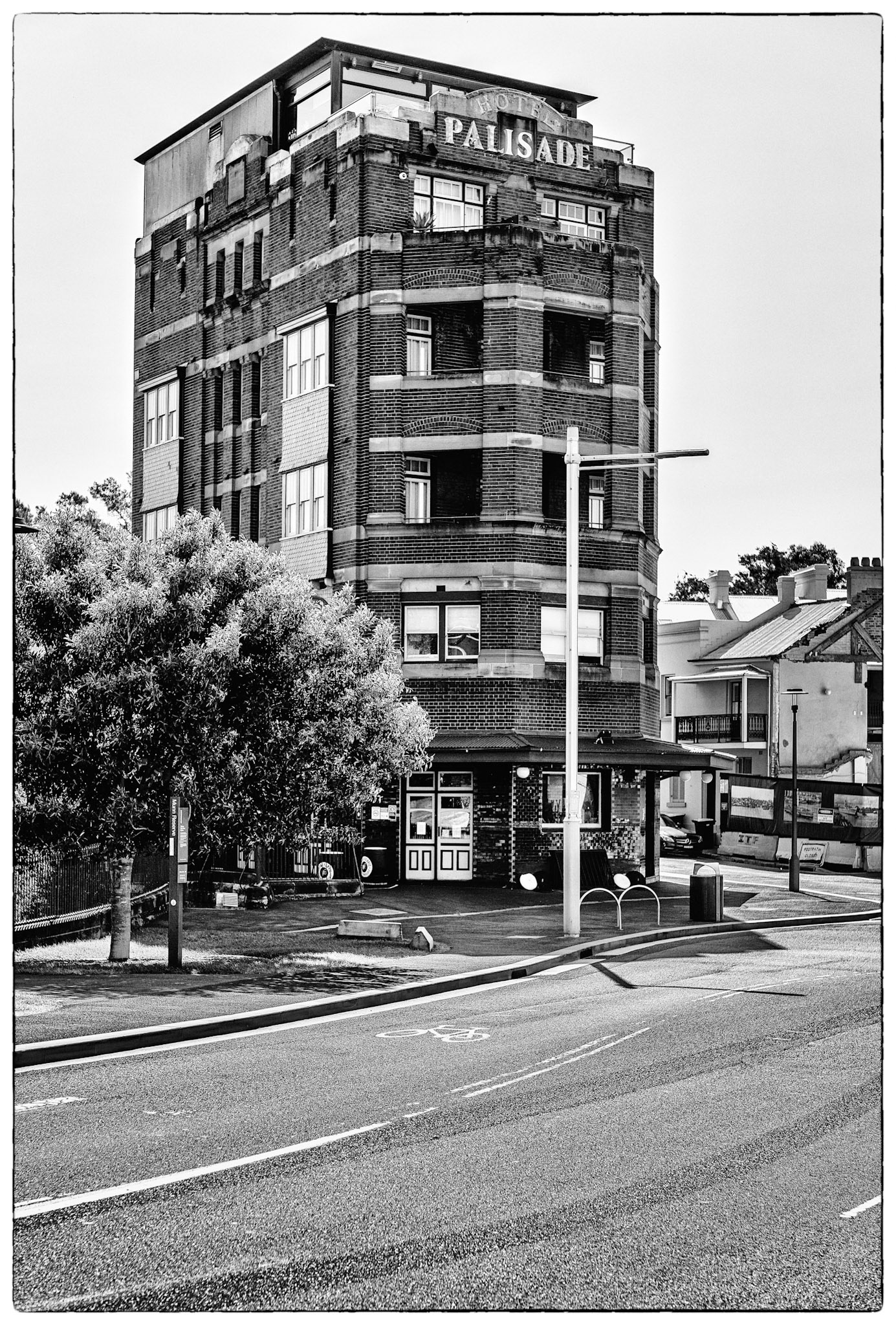 Favourite rooftop bar in Millers Point area of Sydney, Australia.  Australian cities are a great blend of historic buildings and new modern architecture.  In this case The Palisade was built in 1915-16 and is still a functioning and prominent landmark with it's very tall and narrow expression.