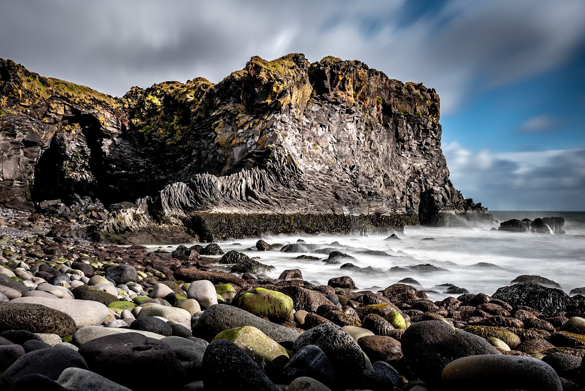 While traveling in Iceland our cottage in Arnarstapi had this very cool tightly cropped picture of some coastal rock formations.  The next day after about a 10 minute drive we ventured down to the coast and found this amazing location.  The picture from the cottage was a close up of this exact spot.  I like the long-exposure wider angle rendition, but the motivation was that cottage picture.