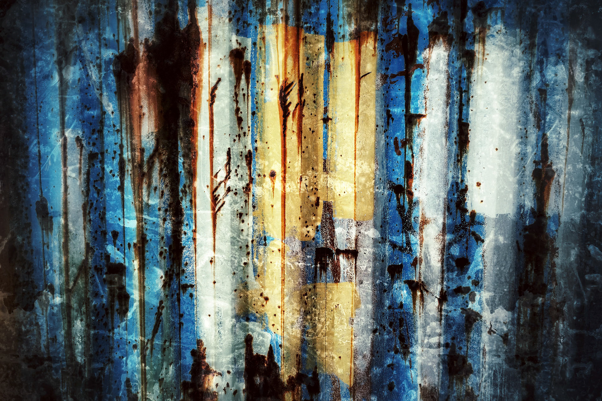 Shipping containers in Iceland shipyard have years of artistic history that has been built up on their currigated sides.