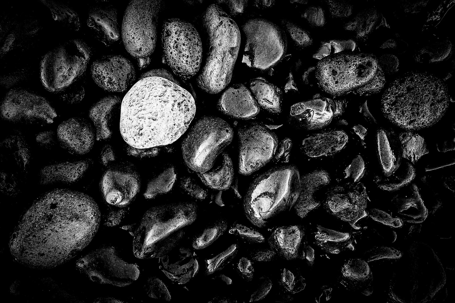 Amazing rocky beach in Maui.  The entire beach is comprised of these baseball szie rocks that rumble with the crashing surf.