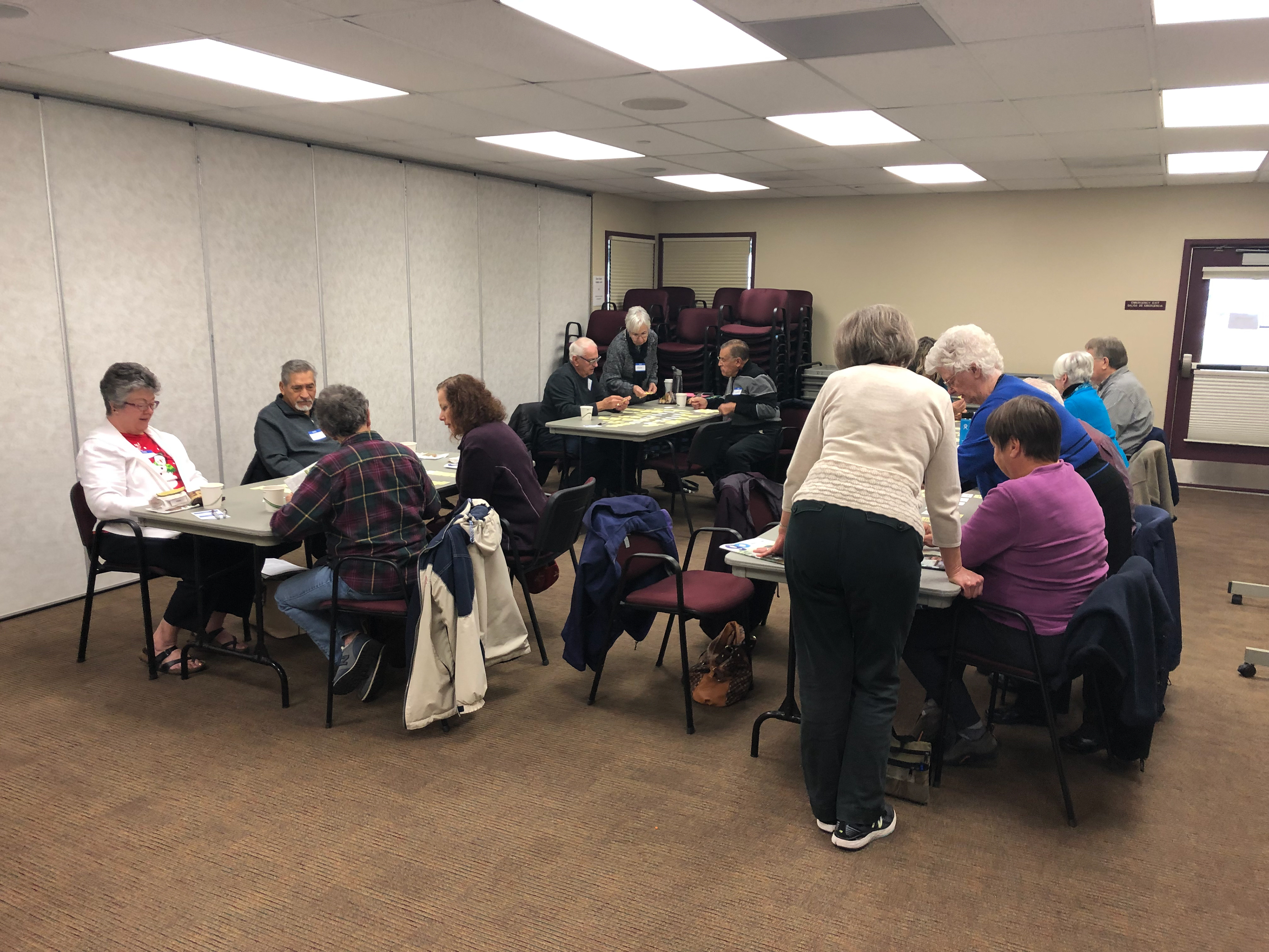 Four groups of participants sorting their cards