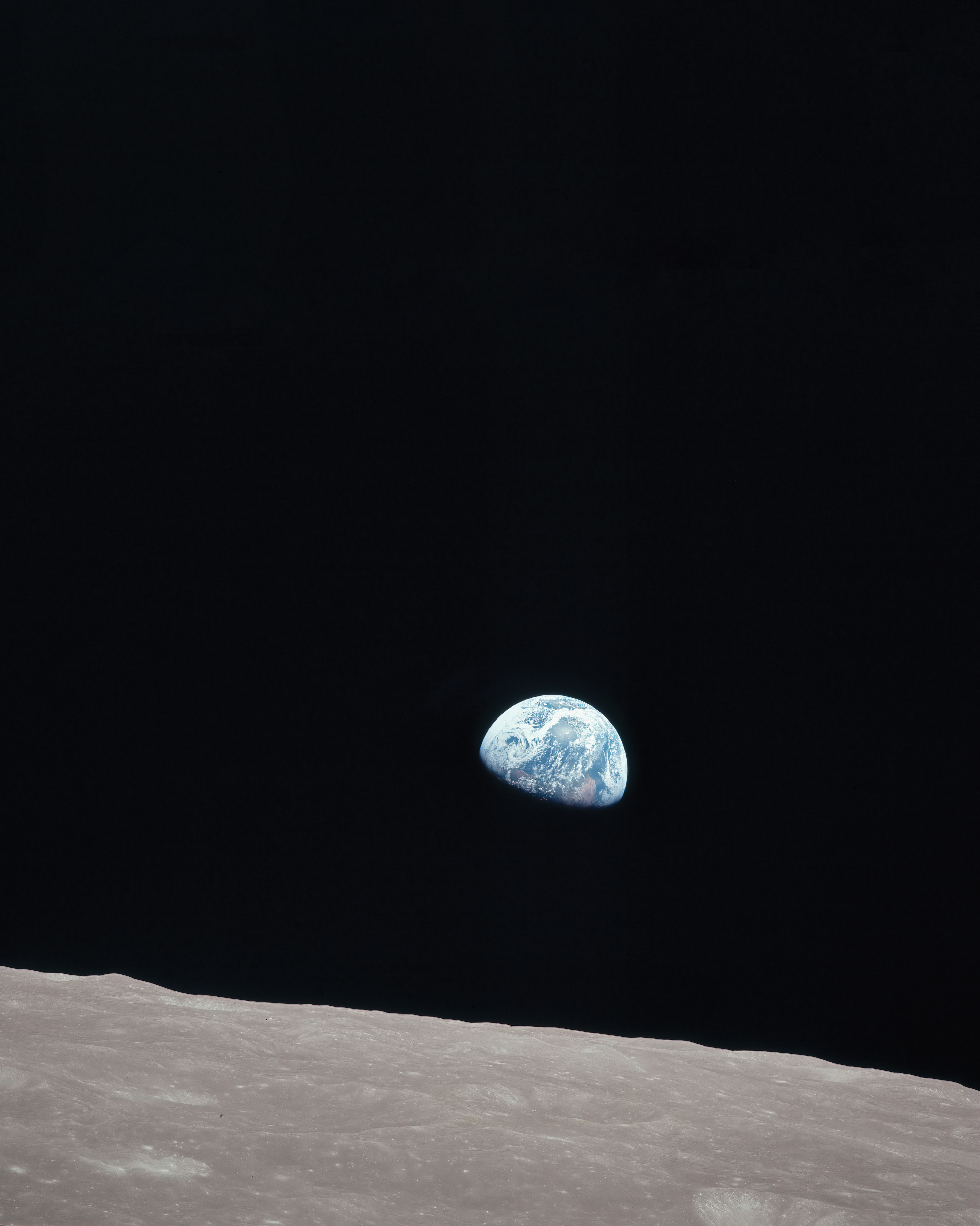 Earthrise by Bill Anders, remastered by Orlando Photoworks, LLC. It's an awe-inspiring photo from the moon's perspective where you see the Earth Rising up in the horizon. 