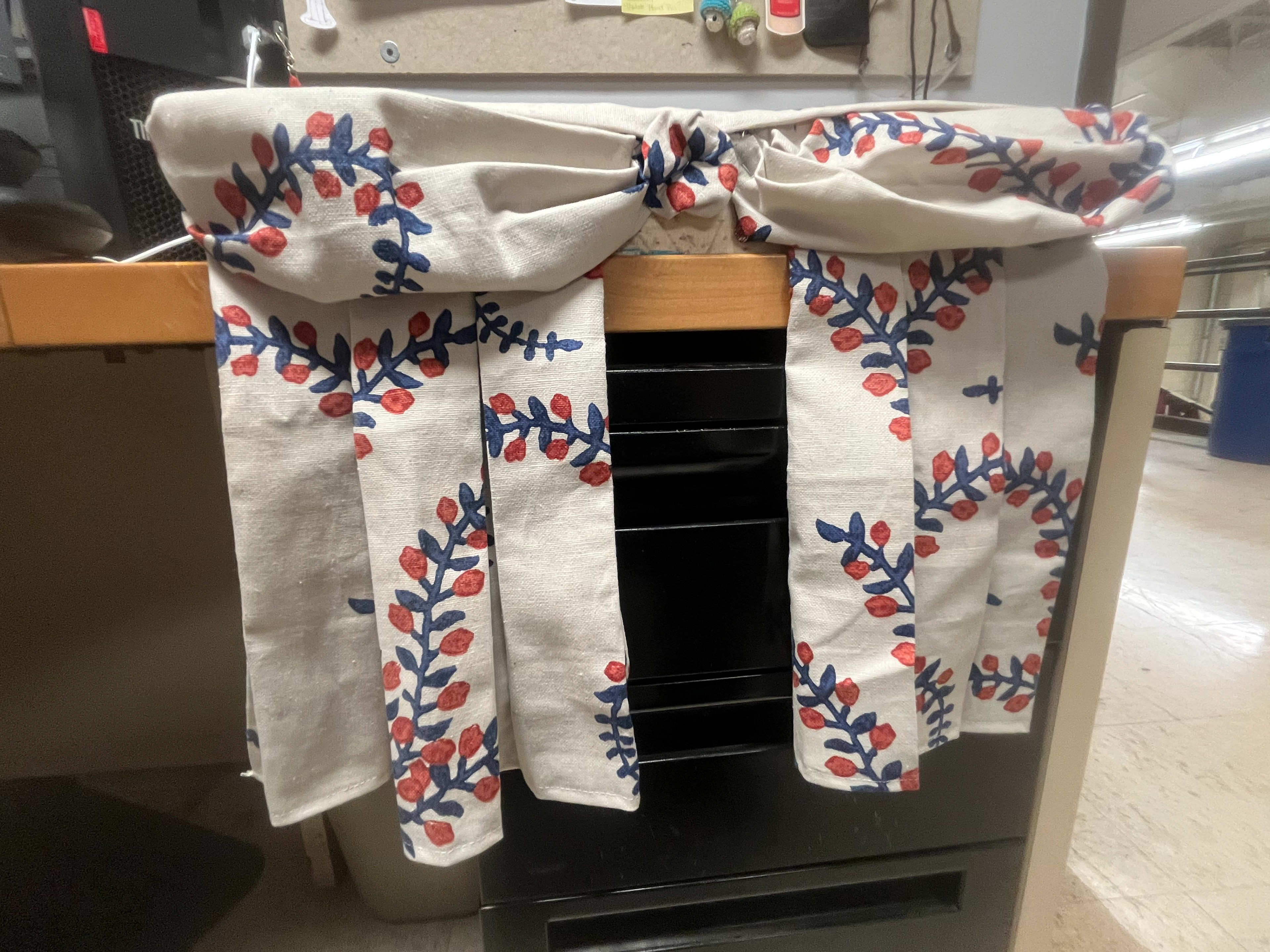 Drapery Board: demonstrate two types of pleats (left: box, right: knife), include 2 swags & one rosette