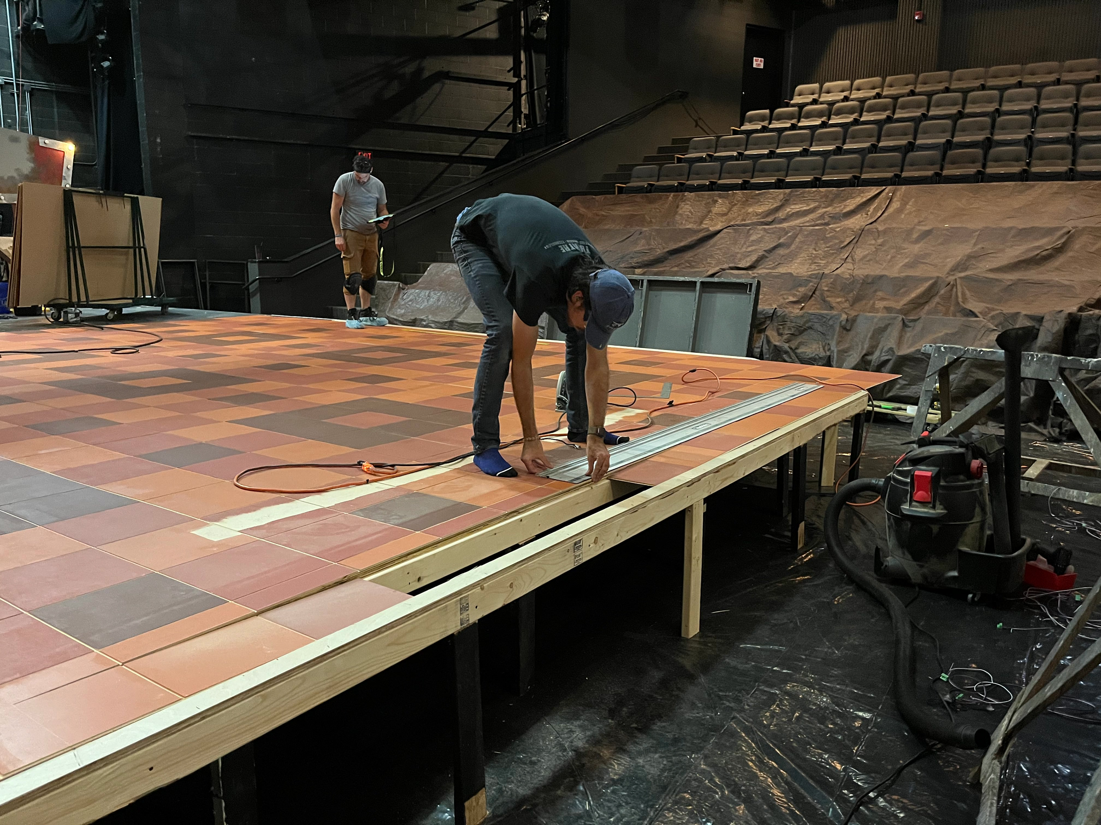 Floor pieces cut to fit in space to allow space for grates.