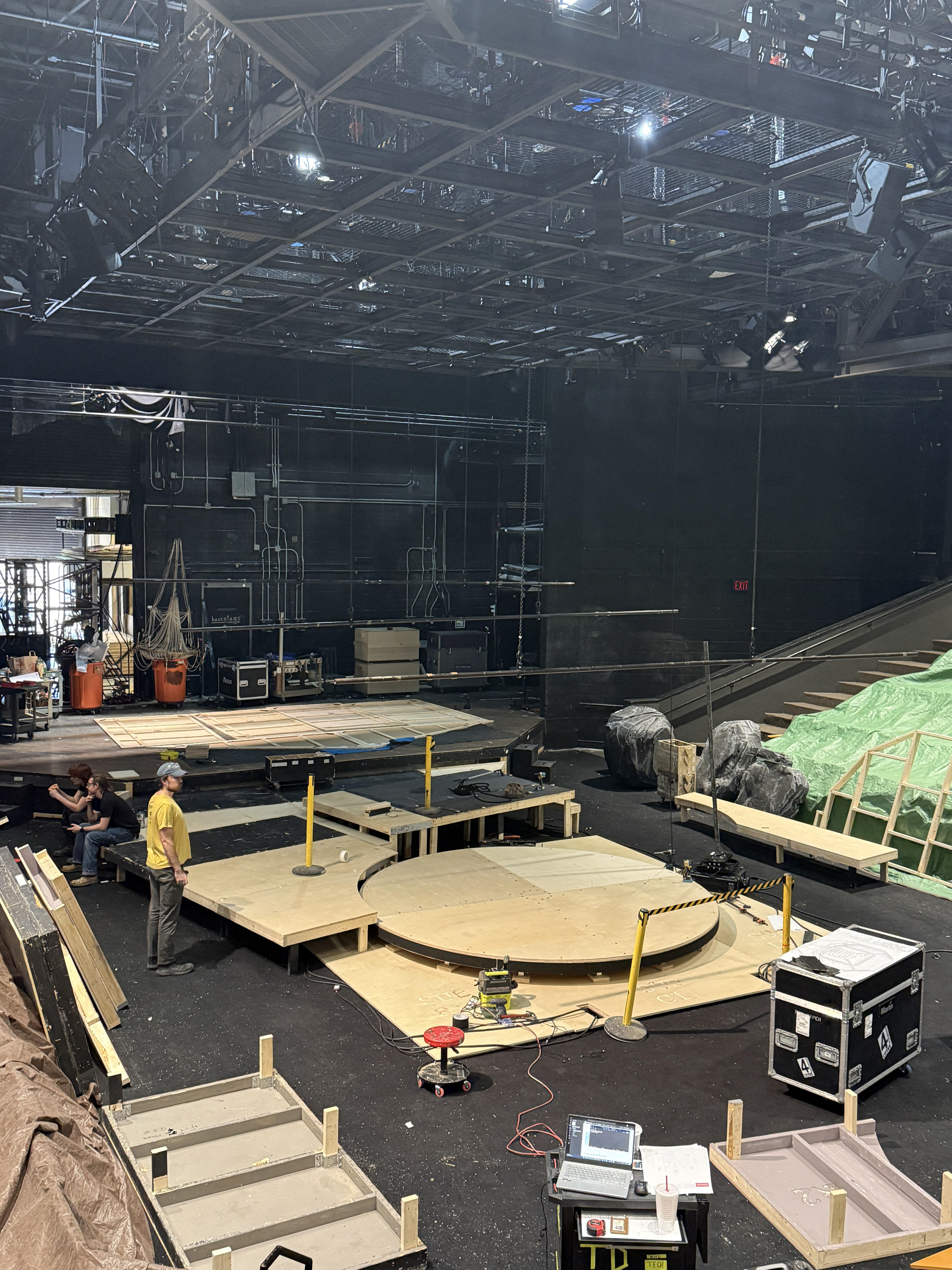 Mid Load-in: Turntable base in, platforms being installed around it, house wall laid out to be rigged