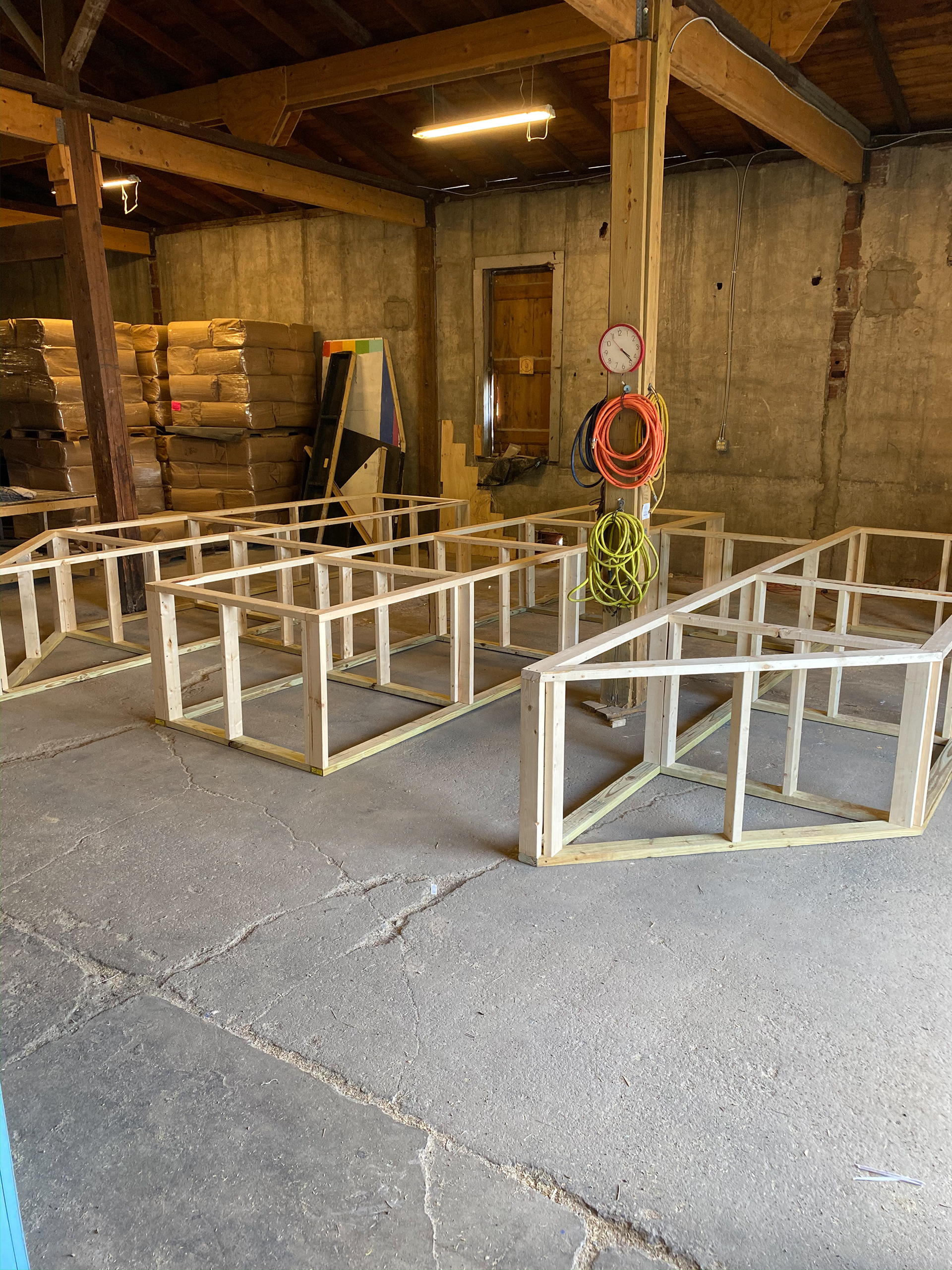 Built stud walls offsite and dry fit before transporting to the space in pieces.