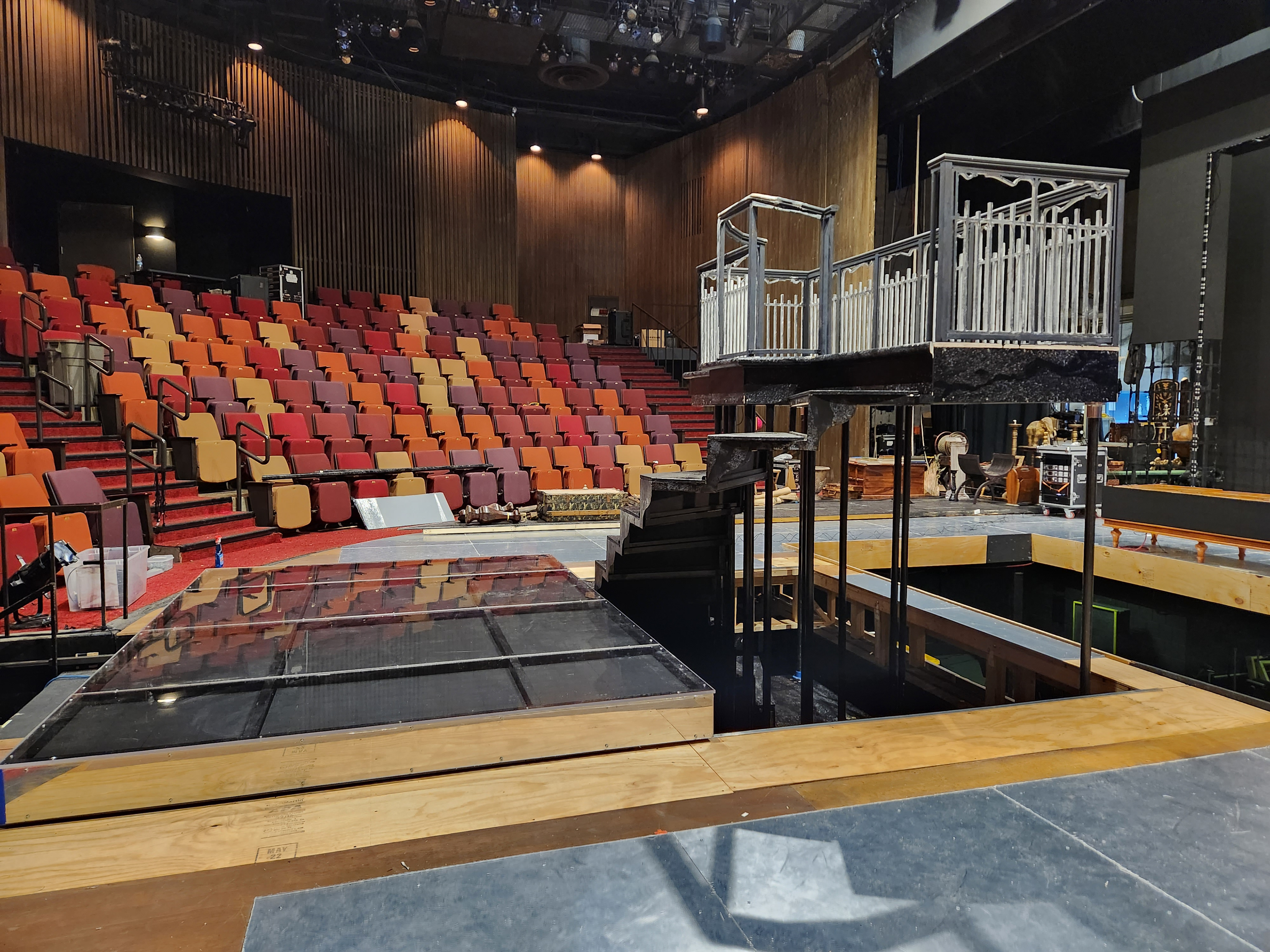 Podium tracked downstage to give clearance for spiral staircase to rise on the lift.
