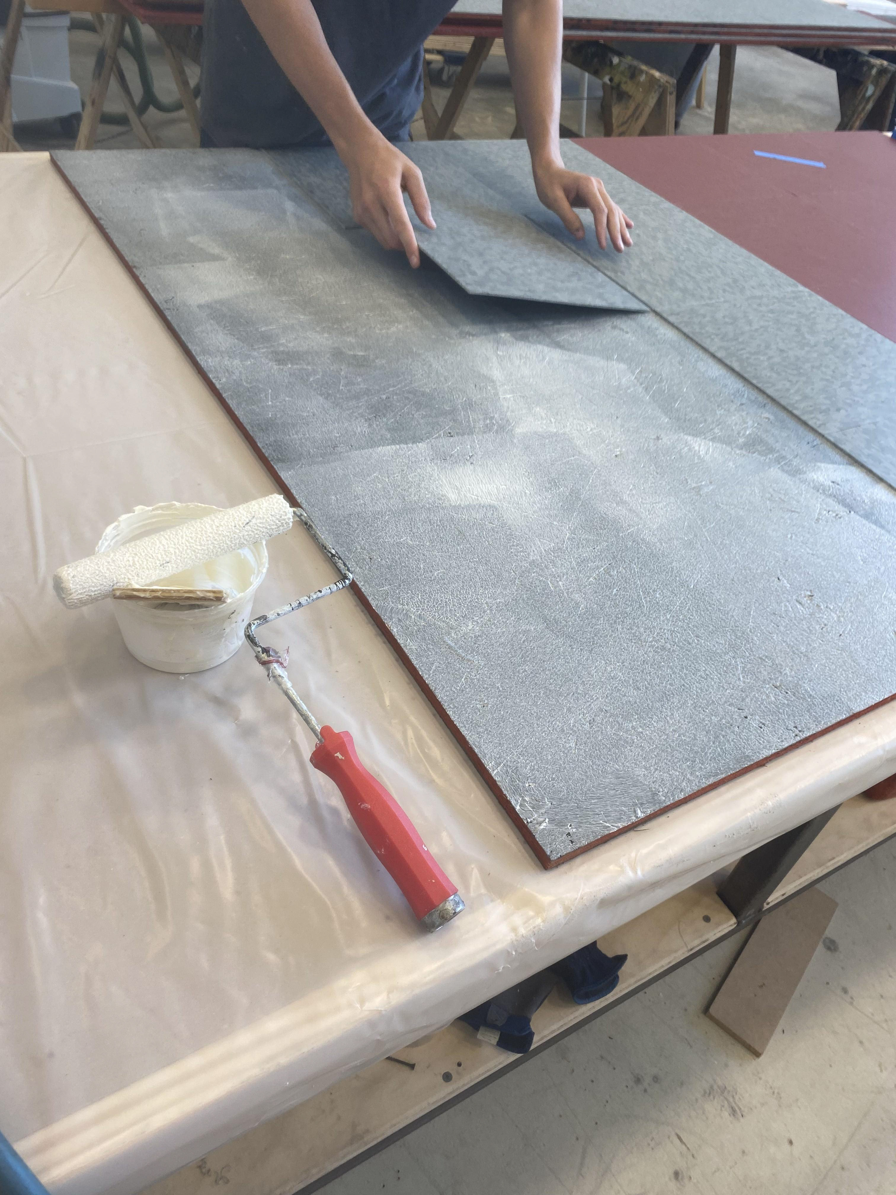 Prepped OSB sheets with tiles for easy install at load-in.