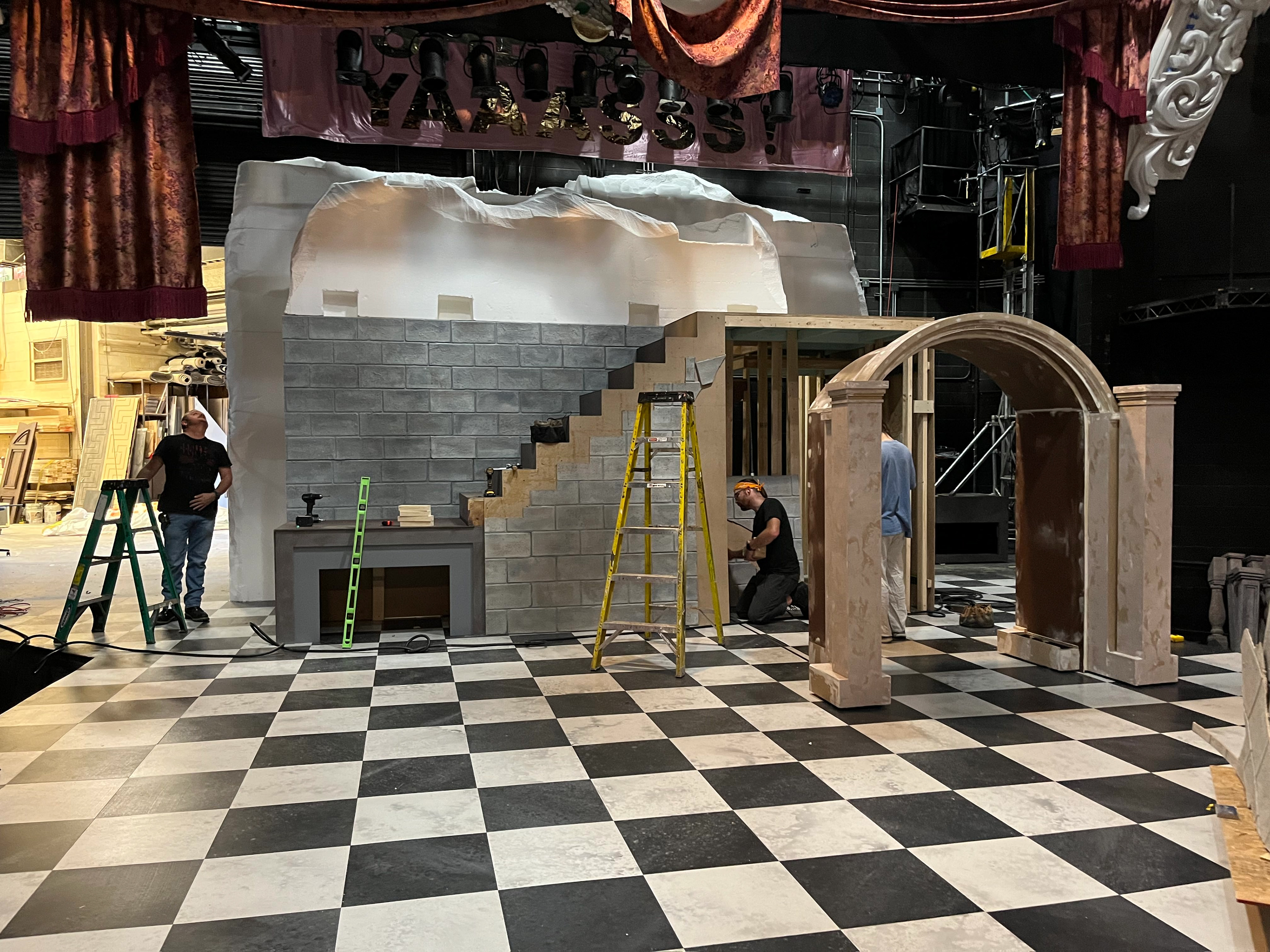Foam "hills" installed with cutouts for speakers & miniature houses.