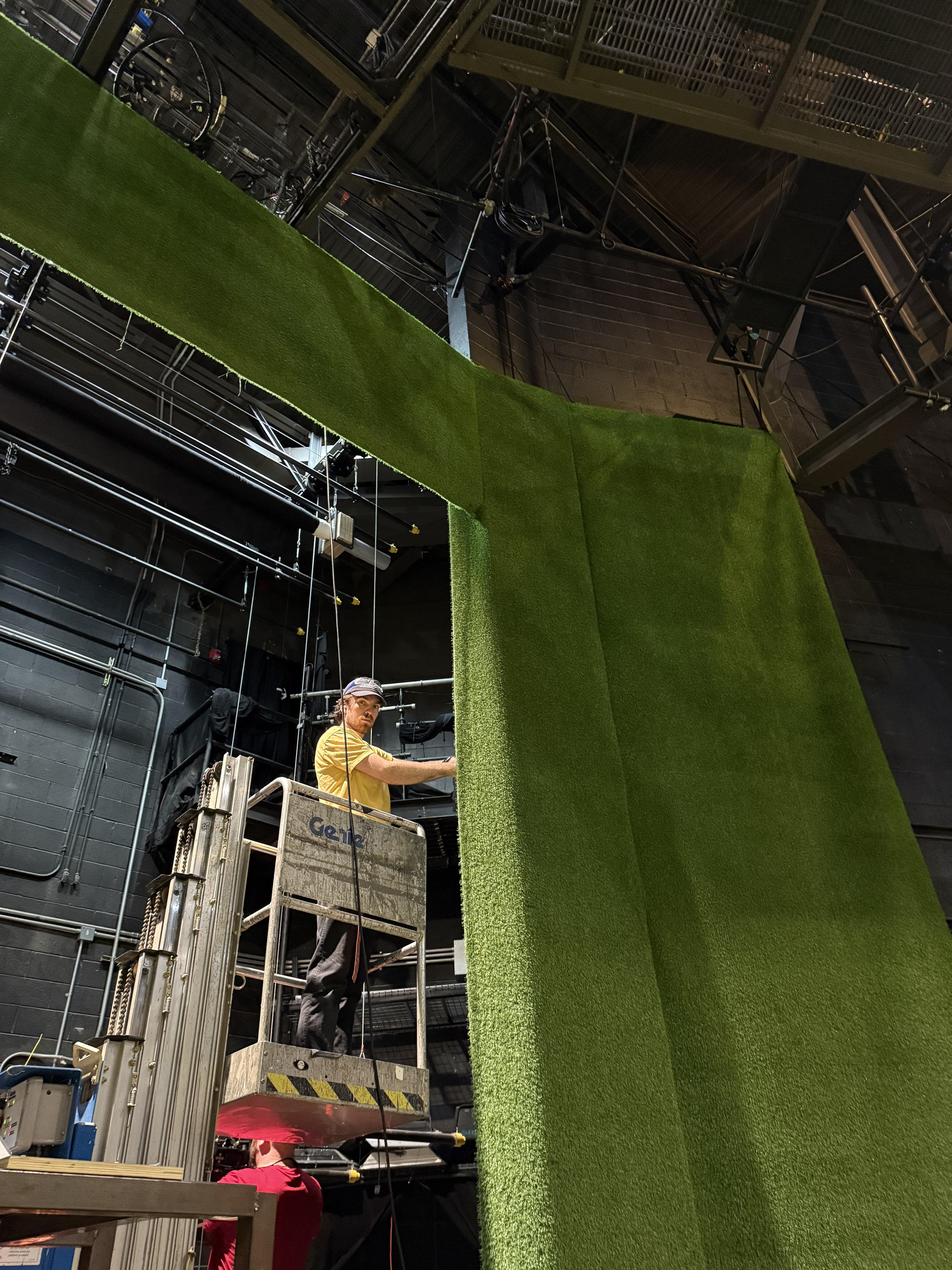 Shop supervisor Bruce securing the wrap-around of the turf false pro
