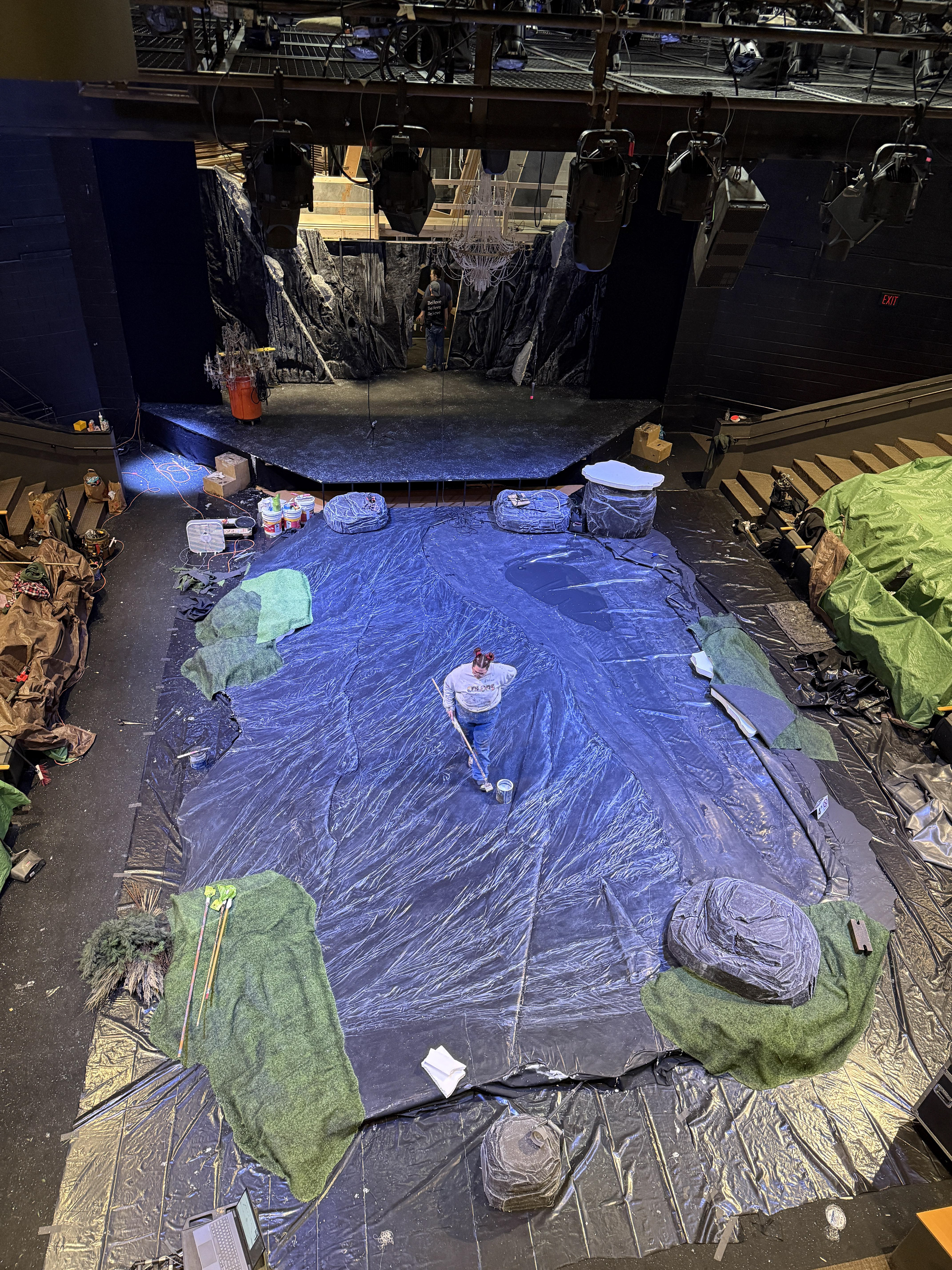 Scenic charge Diane adding another coat of sealer to the slate deck