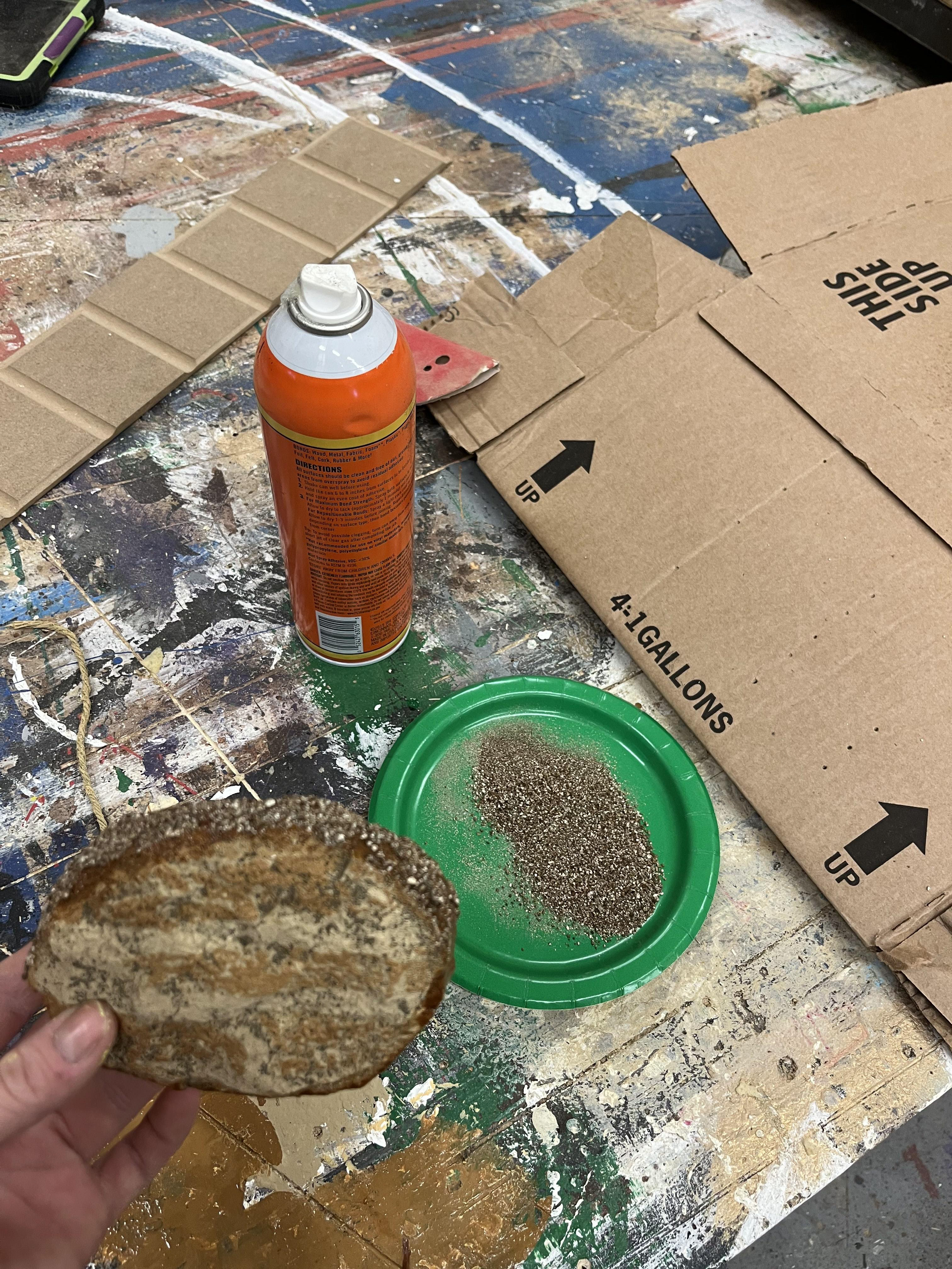 Painted on toast marks - vermiculite spray glued on as seeds
