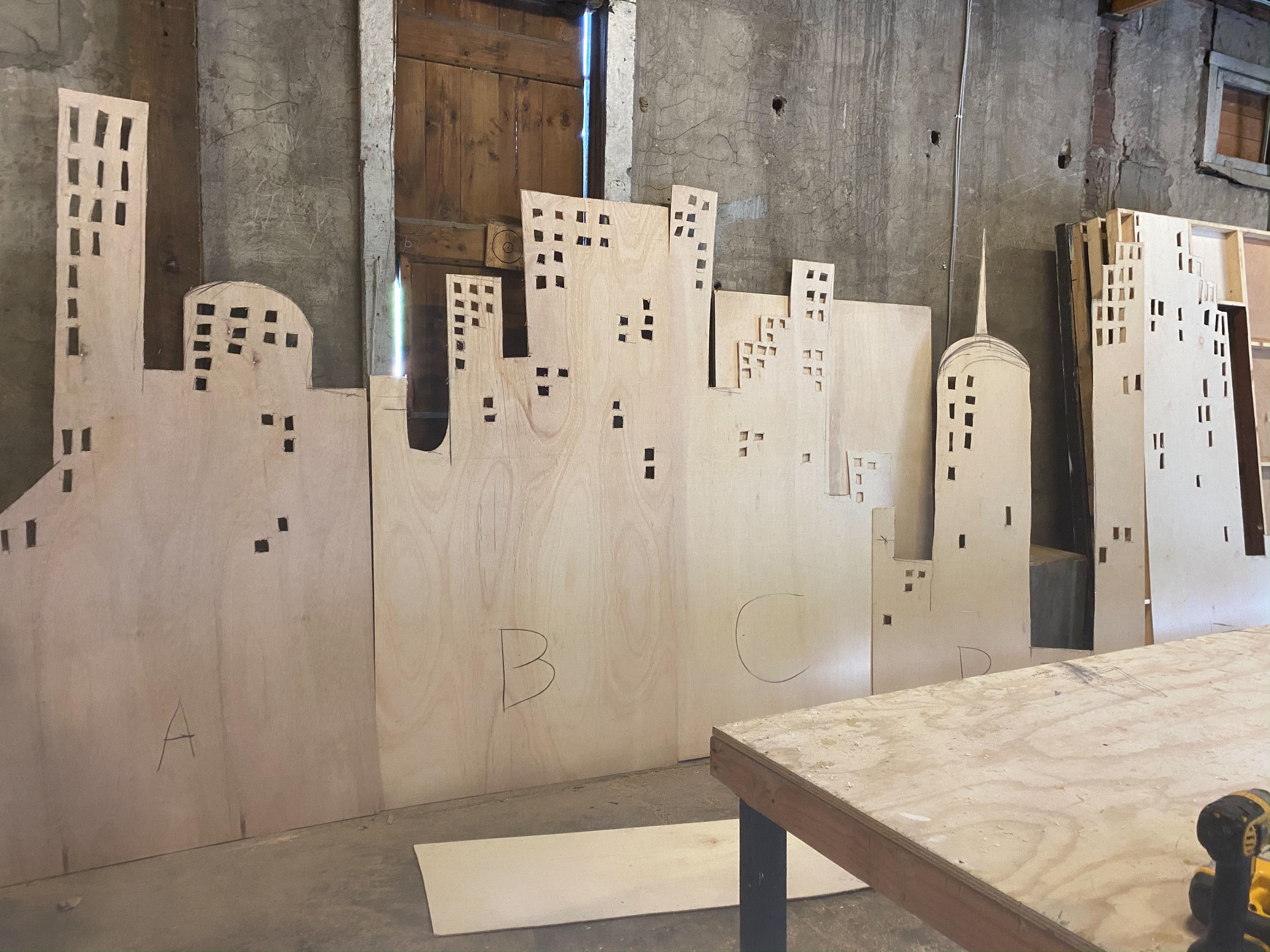 Cut out skyline and window holes as sketched by designer.